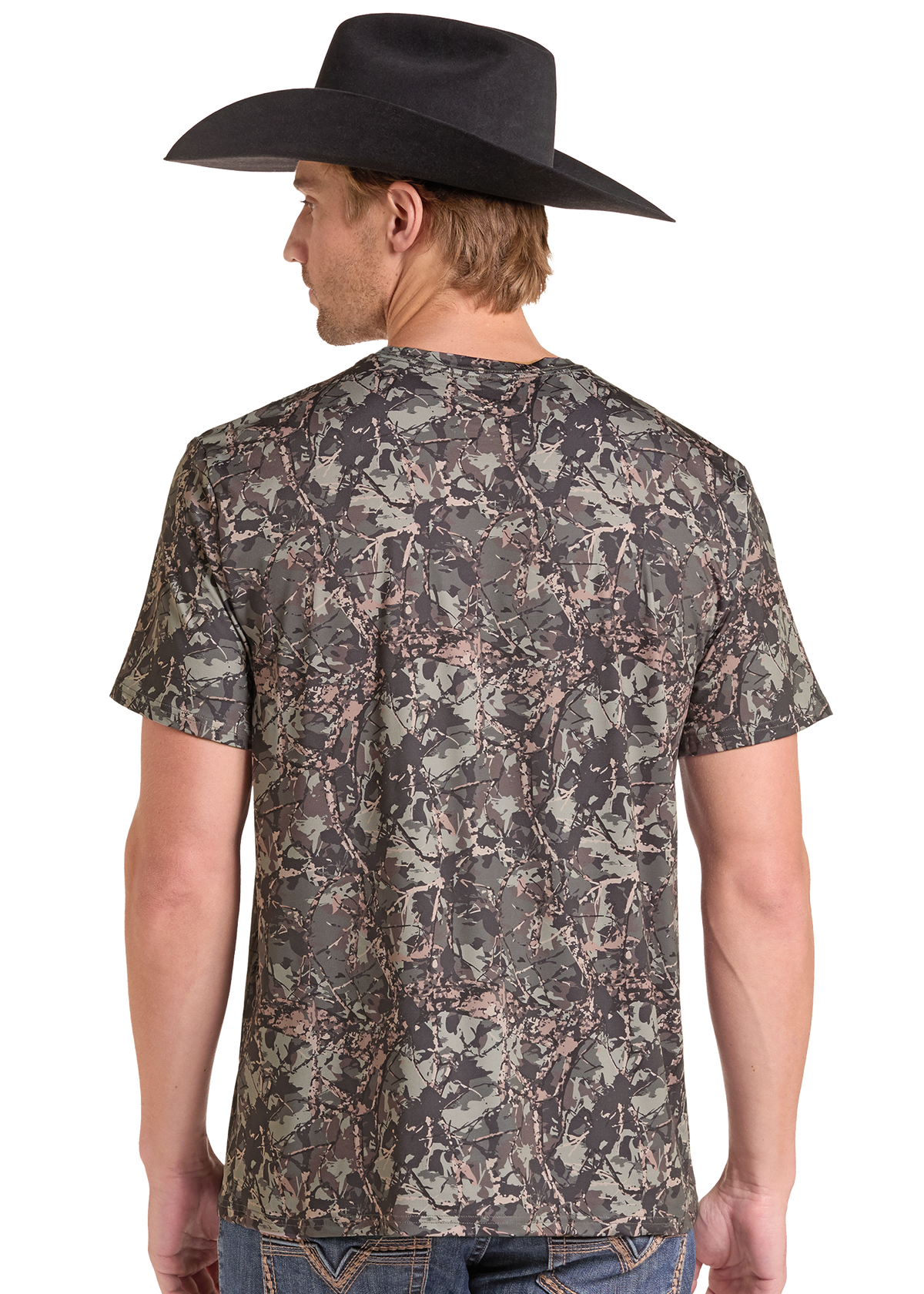 A man shown from the back wearing a short-sleeve crewneck t-shirt with a brown, gray, and beige woodland camouflage pattern, paired with a black cowboy hat and blue jeans, against a plain white background.