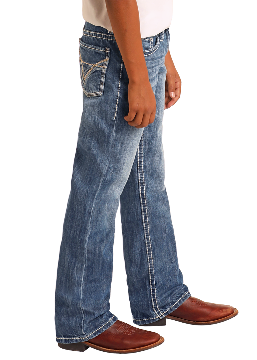 A child wears Rock & Roll Denim Boys' Ivory Top-Stitching Regular Fit Bootcut Jeans, paired with a white shirt and brown cowboy boots, standing against a plain light background with only the lower half visible.