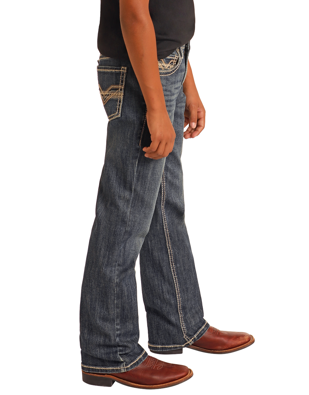 A person wearing Rock & Roll Denim Boys' Regular Fit Raised Embroidery Bootcut Jeans stands sideways in brown cowboy boots and a black t-shirt against a plain white background.