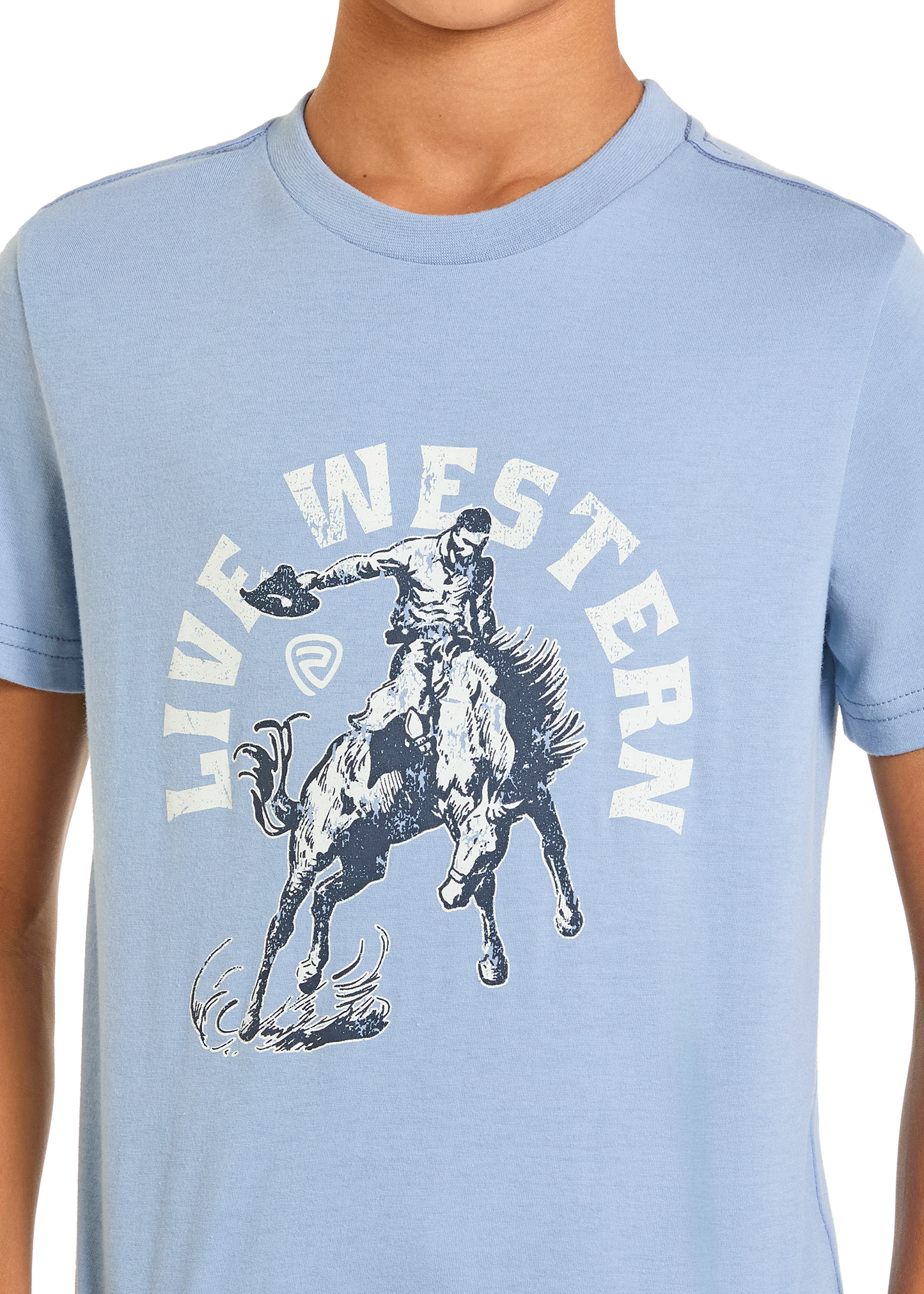 A boy sports the Rock & Roll Denim Boys' Live Western Graphic Tee, featuring a cowboy riding a bucking horse and "LIVE WESTERN" text—a perfect pick for adventurous spirits.