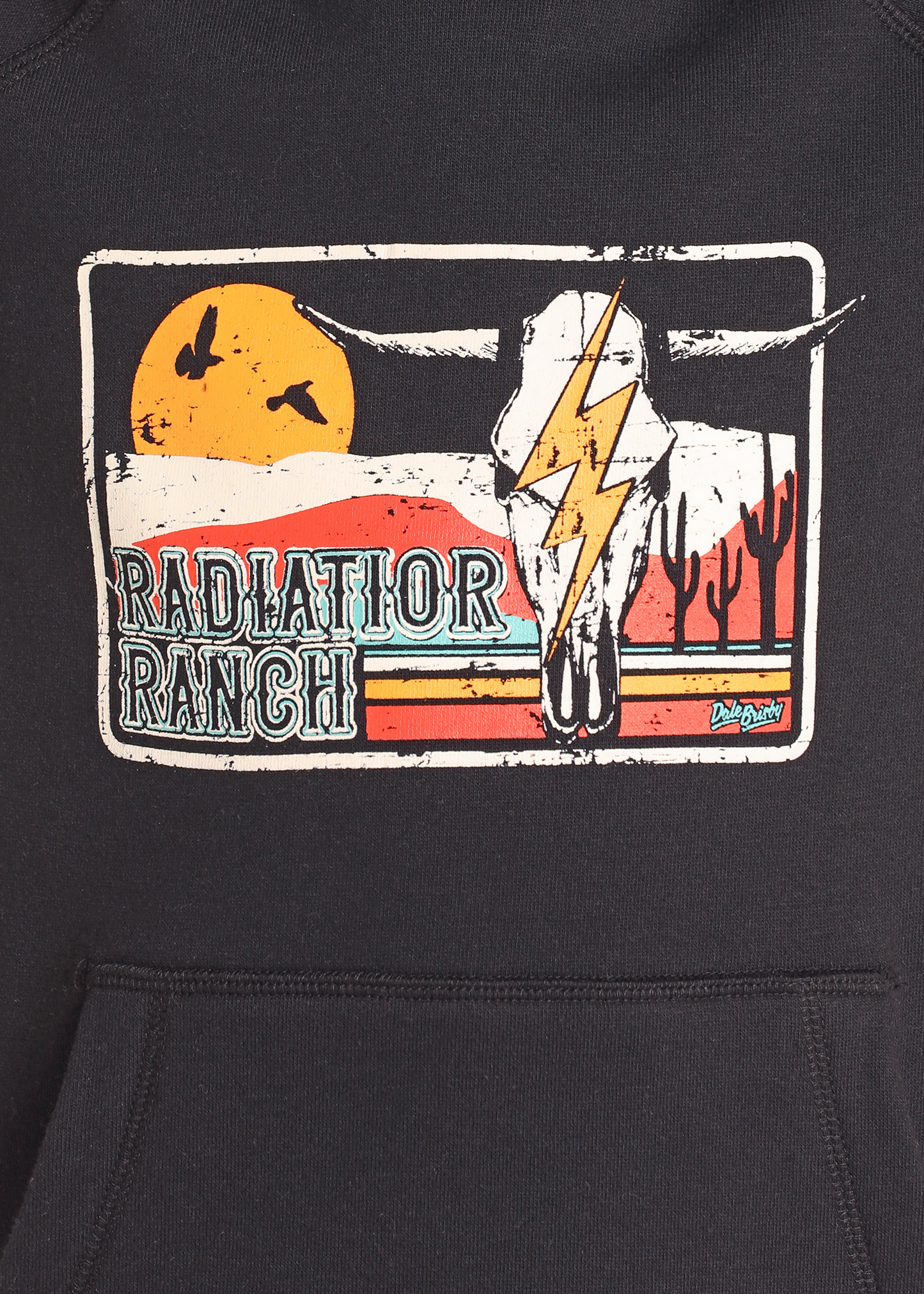 The Boys' Dale Brisby Radiator Ranch Graphic Hoodie by Rock & Roll Denim features a sunset, flying birds, cactus, and cow skull with lightning bolt, plus bold "Radiator Ranch" text—ideal for any Dale Brisby hoodie fan.
