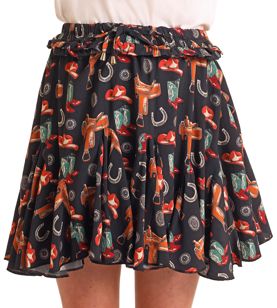 The Girls' Western Print Godet Skirt - M by Rock & Roll Denim is a black, flared skirt with a colorful western pattern, featuring cowboy hats, boots, and more. It has a comfortable ruffled, elastic waistband.