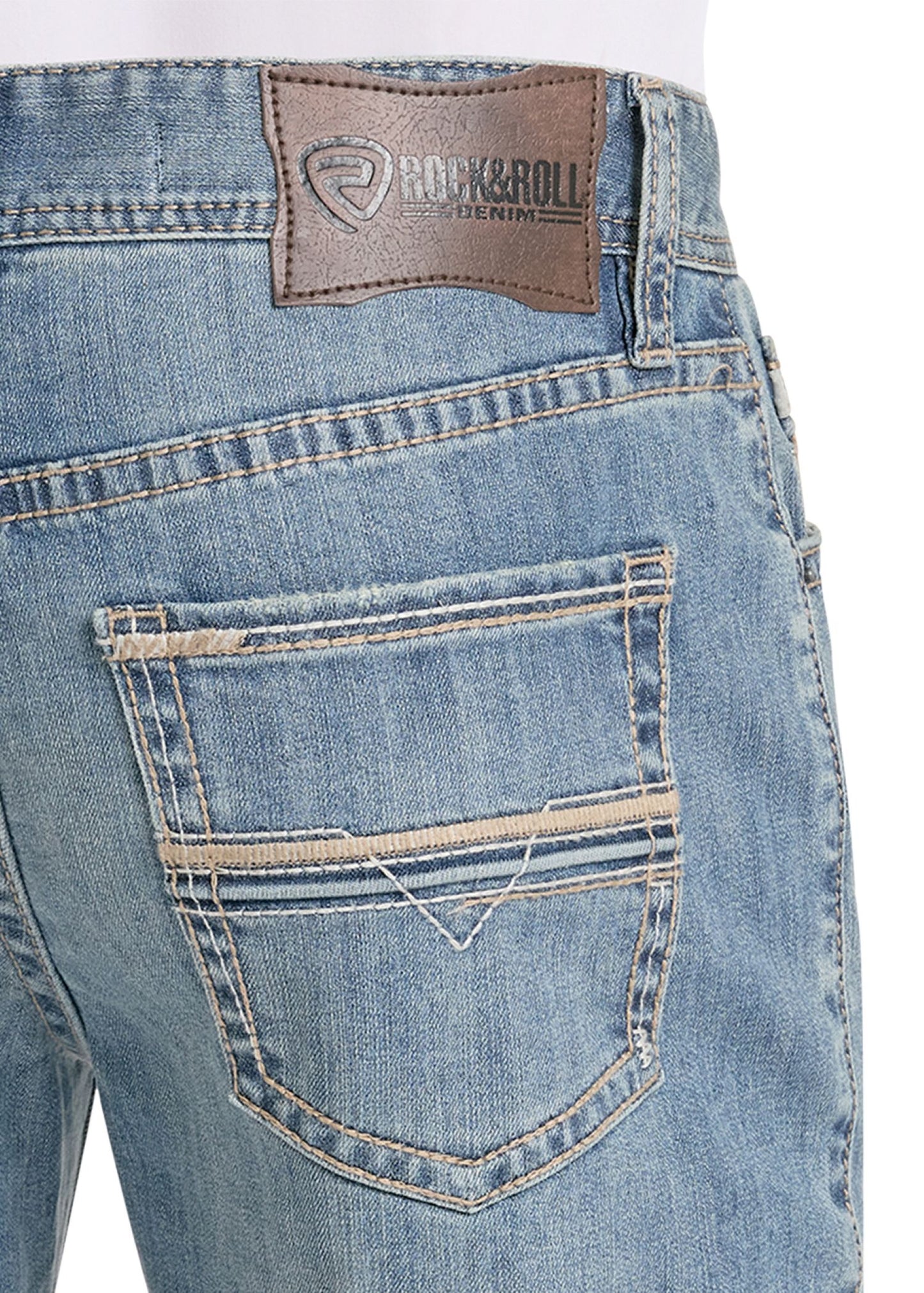 Close-up of blue jeans with a brand label on a white background