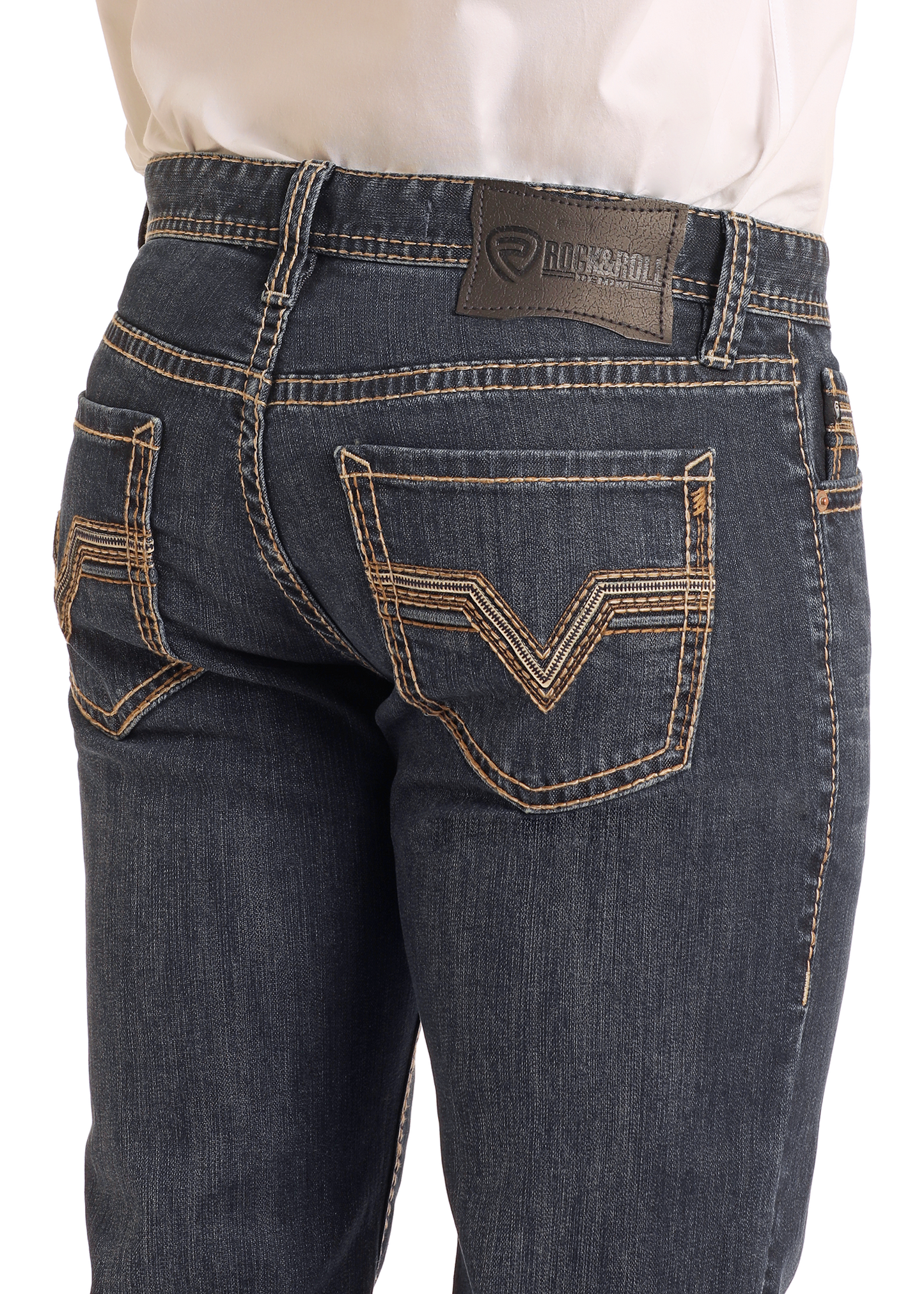 Close-up of the back of a person wearing Rock & Roll Denim Slim Fit Dark Wash Two-Tone Stitch Straight Leg Jeans, featuring contrast stitching, decorative back pocket details, and a brown leather brand patch on the waistband.