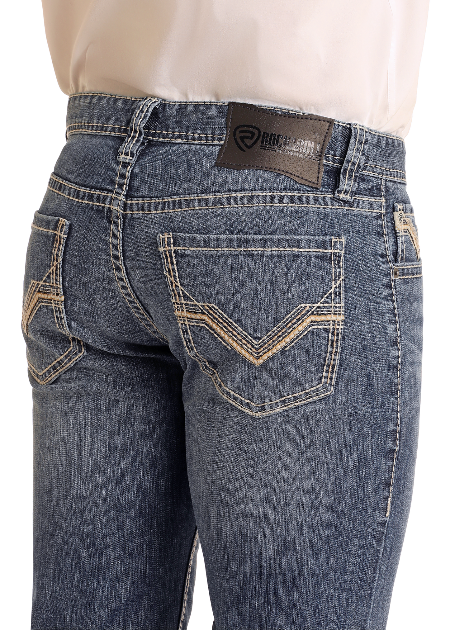 A person is wearing Rock & Roll Denim Slim Fit Pleather Embroidered Straight Leg Jeans, featuring white stitching, a brown brand label on the waistband, and decorative embroidery on the back pockets, photographed from the back waist down.