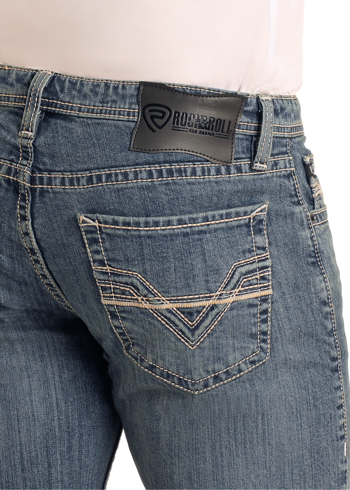 A close-up of the back of a person wearing Rock & Roll Denim Slim Fit Raised Pocket Stitch Straight Leg Jeans, featuring decorative pocket stitching and a black brand patch on the waistband.