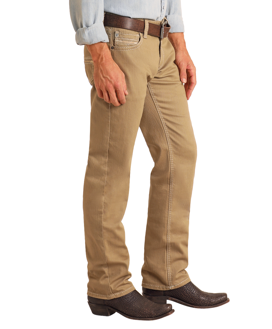 A person wears Rock & Roll Denim Khaki Slim Straight Jeans, a brown belt, light blue shirt, and dark brown cowboy boots, shown from mid-chest down against a white background.