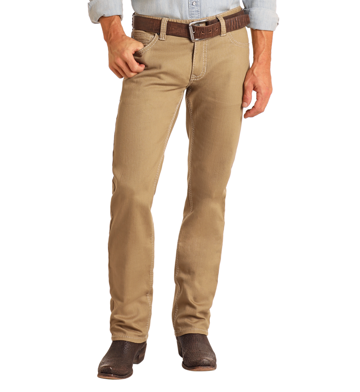 A person wearing Rock & Roll Denim Khaki Slim Straight Jeans, a brown belt, a light blue shirt, and dark brown boots stands against a plain white background with one hand in their pocket.