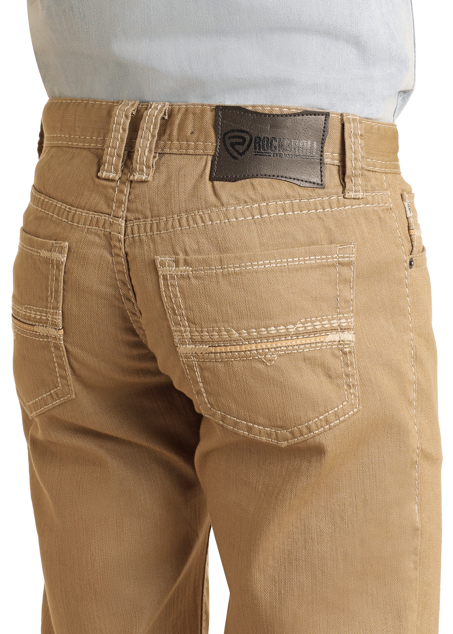 Close-up of the back of a person wearing Rock & Roll Denim Khaki Slim Straight Jeans with white stitching and a dark leather brand patch, styled with a light blue shirt tucked in for a classic slim fit look.