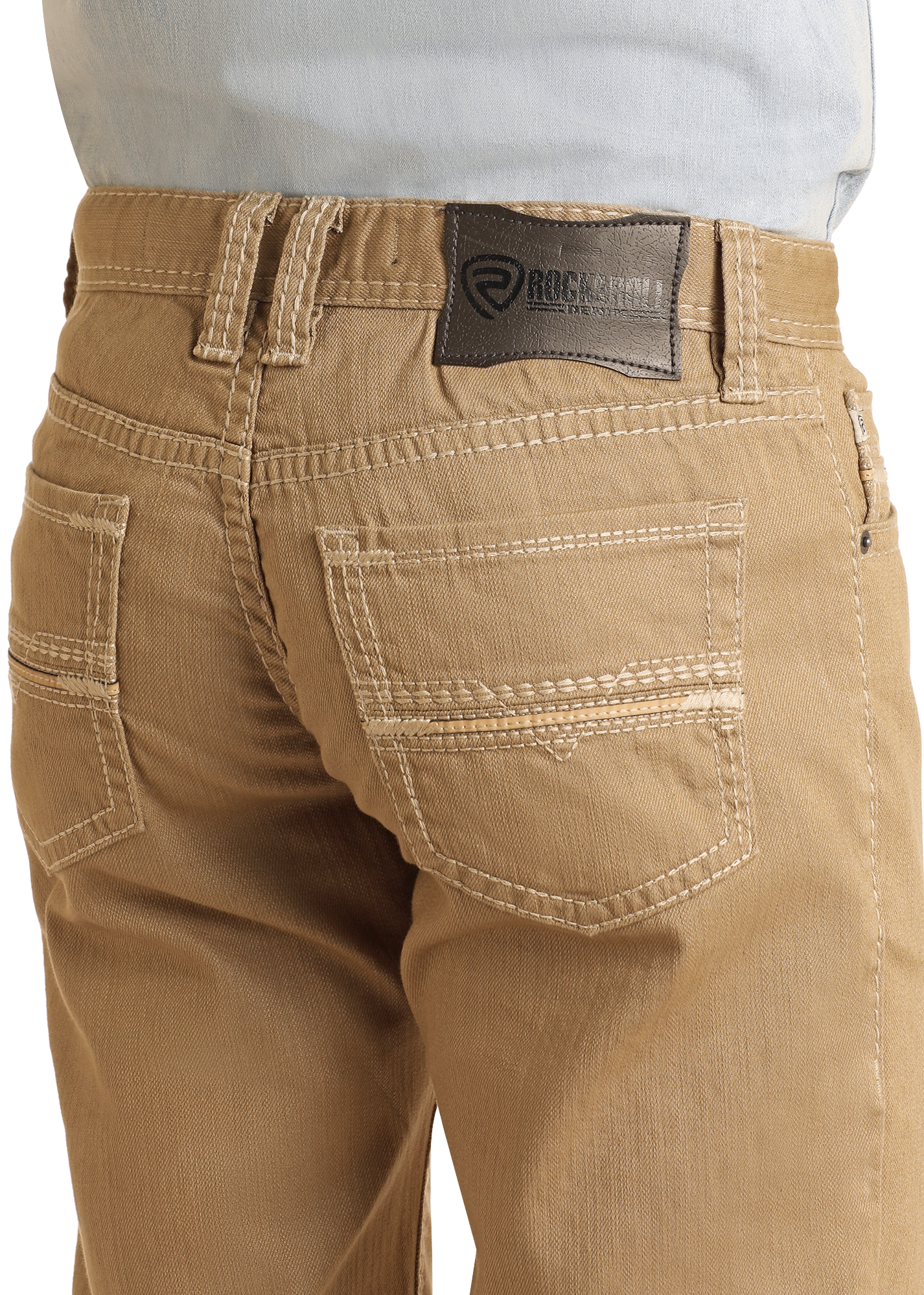Close-up of the back of a person wearing Rock & Roll Denim Khaki Slim Straight Jeans with white stitching and a dark leather brand patch, styled with a light blue shirt tucked in for a classic slim fit look.