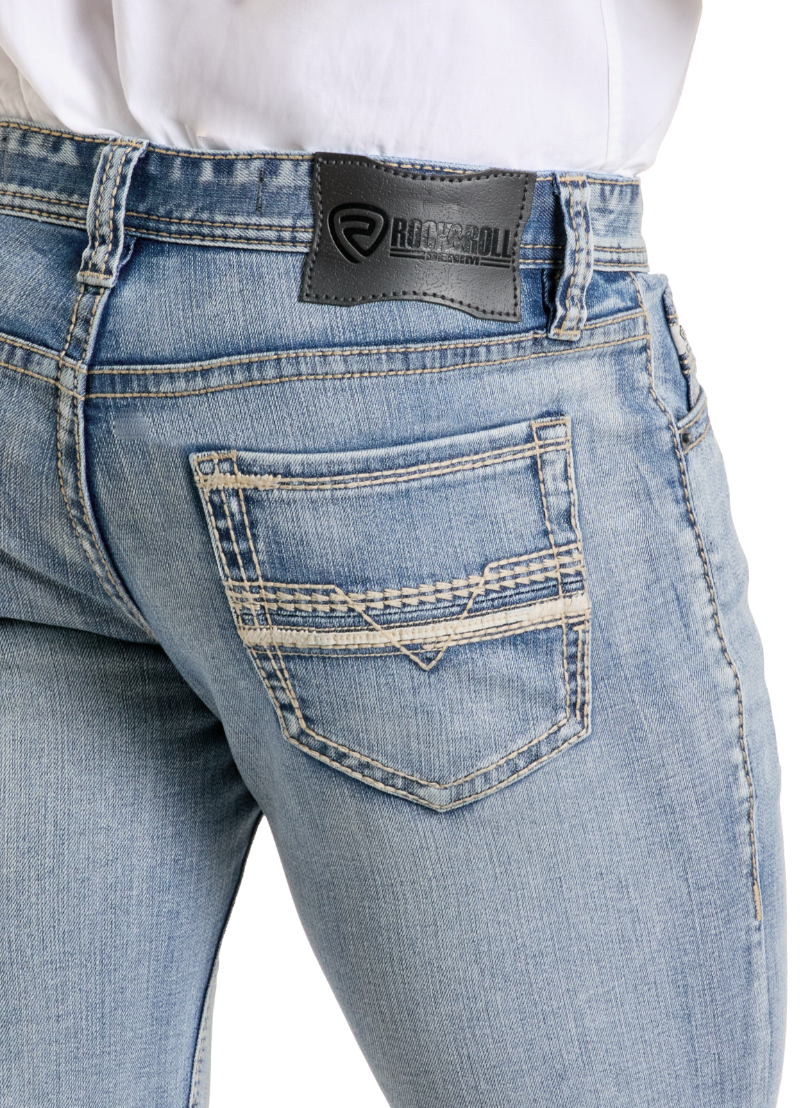 A close-up of a person wearing Rock & Roll Denim Slim Fit Leather Stitch Pocket Straight Leg Jeans with visible stitching, a back pocket, and a black leather Rock & Roll patch on the waistband. The white shirt is tucked in.