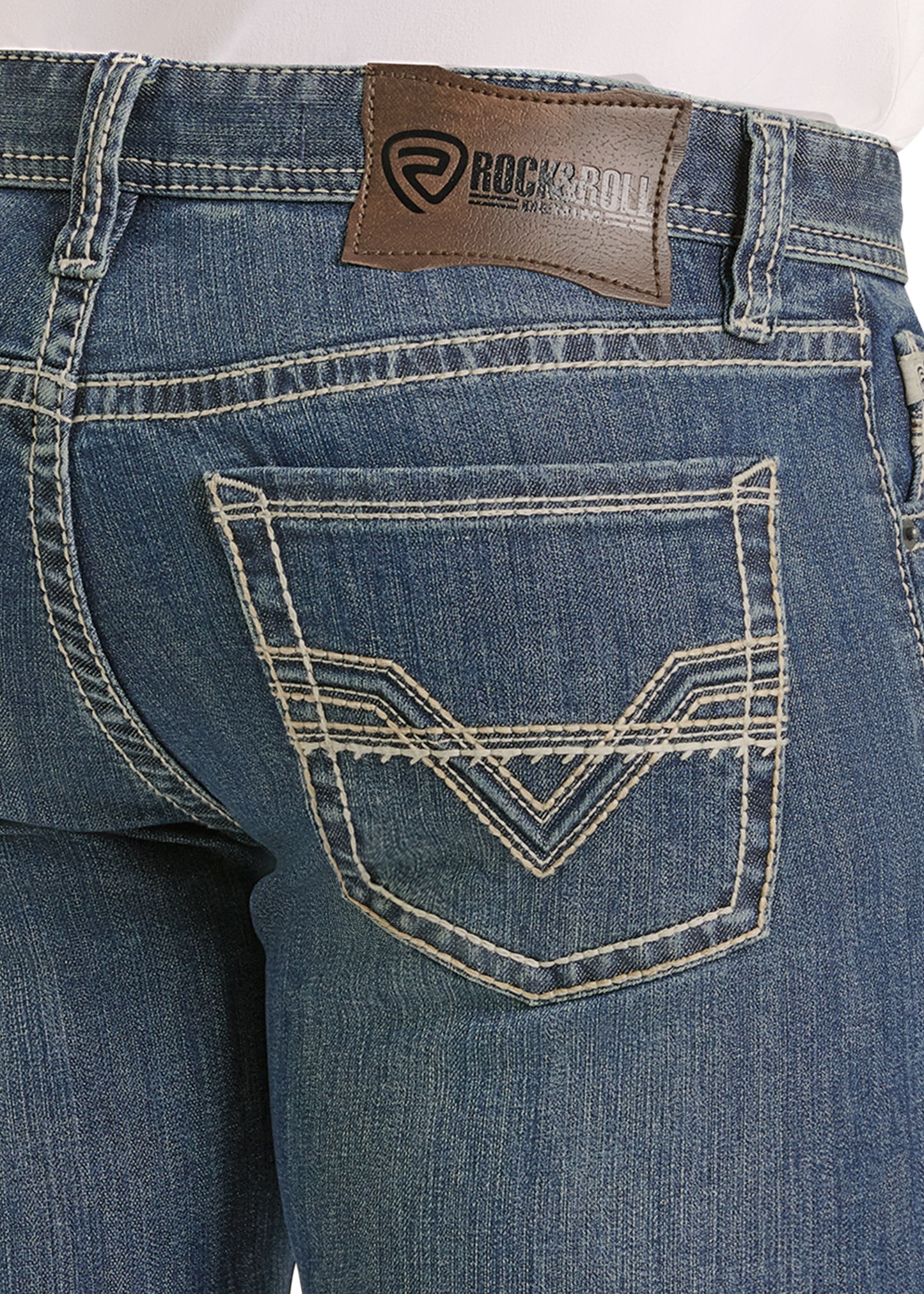 Close-up of the back pocket of blue Slim Fit Two Tone Straight Leg Jeans by Rock & Roll Denim, featuring white stitching, a brown leather logo patch on the waistband, and a decorative chevron pattern on the pocket.