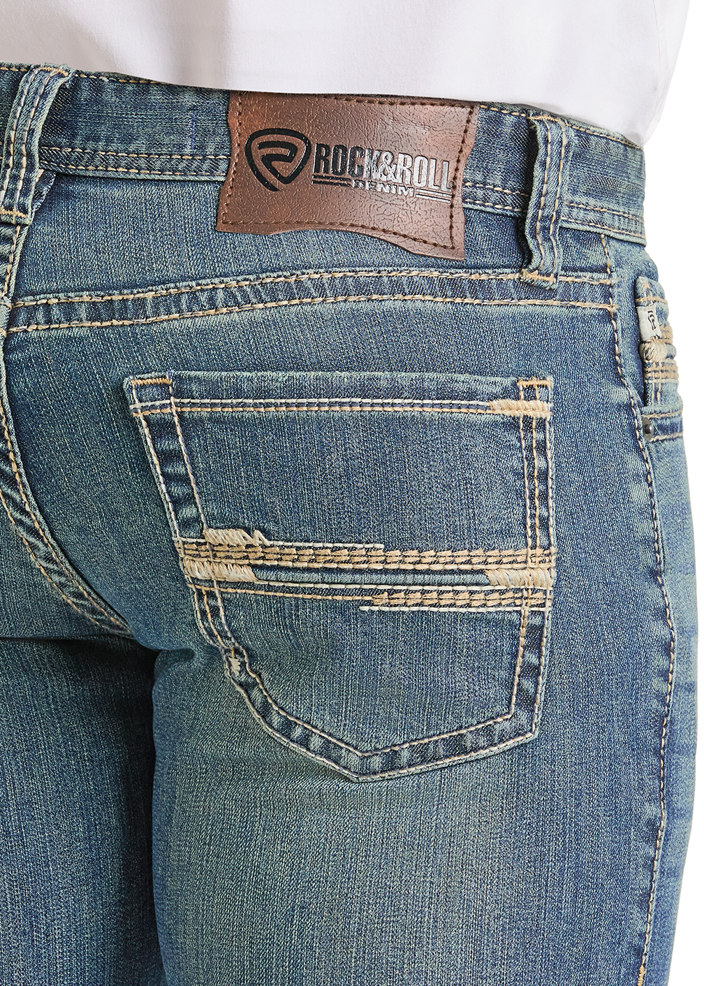 Close-up of blue jeans with a brand label on the back pocket.