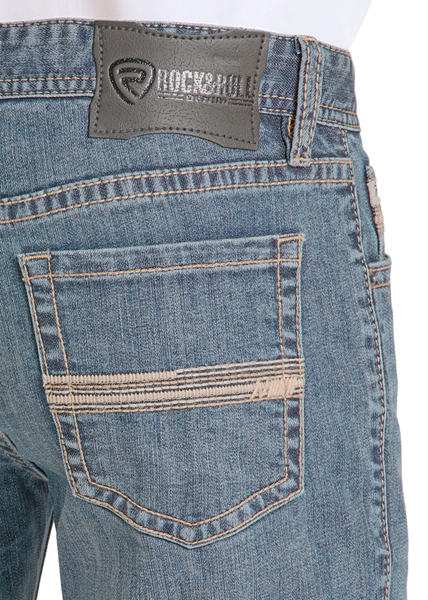 Close-up of blue jeans with a 'Rock & Roll' label on a white background