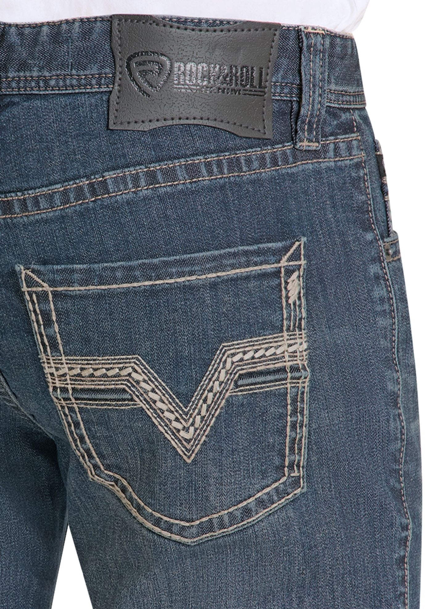 Close-up of blue jeans with a brand logo on the pocket area.