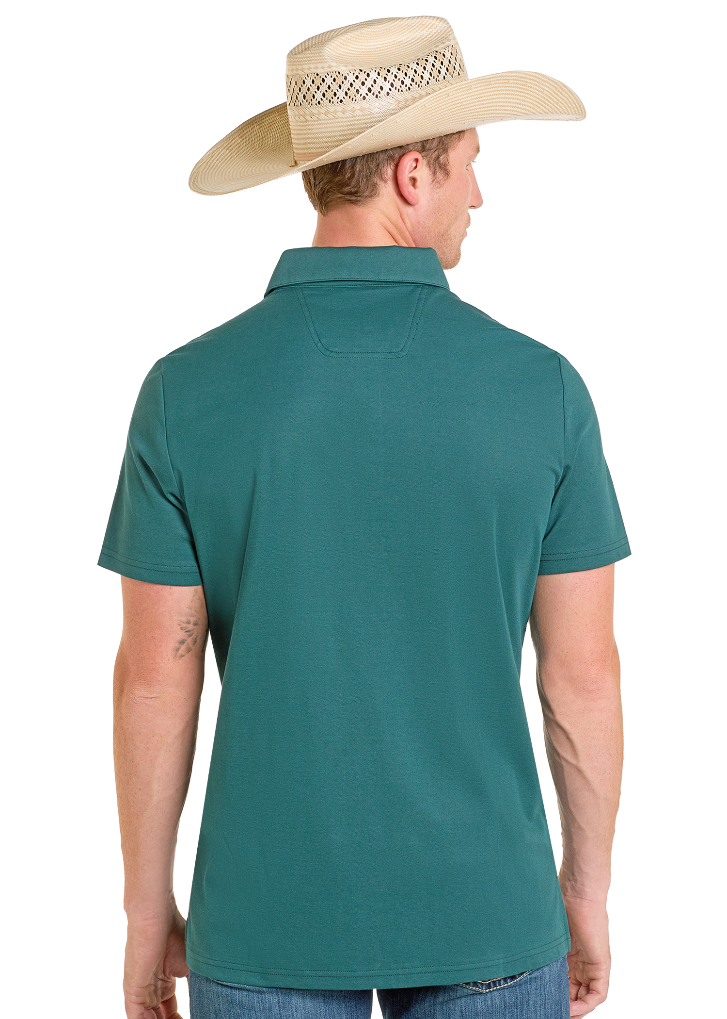 A man in a Rock & Roll Denim Border Print Polo and blue jeans, wearing a straw cowboy hat, stands with his back to the camera against a plain white background.