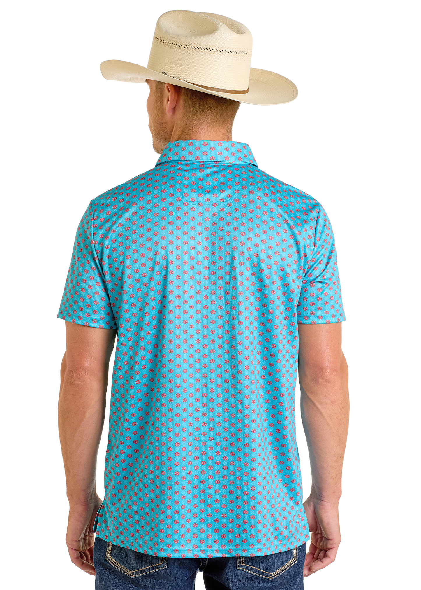A man wearing a cream cowboy hat, blue jeans, and a Rock & Roll Denim Turquoise Geo Print Polo stands facing away from the camera against a white background.