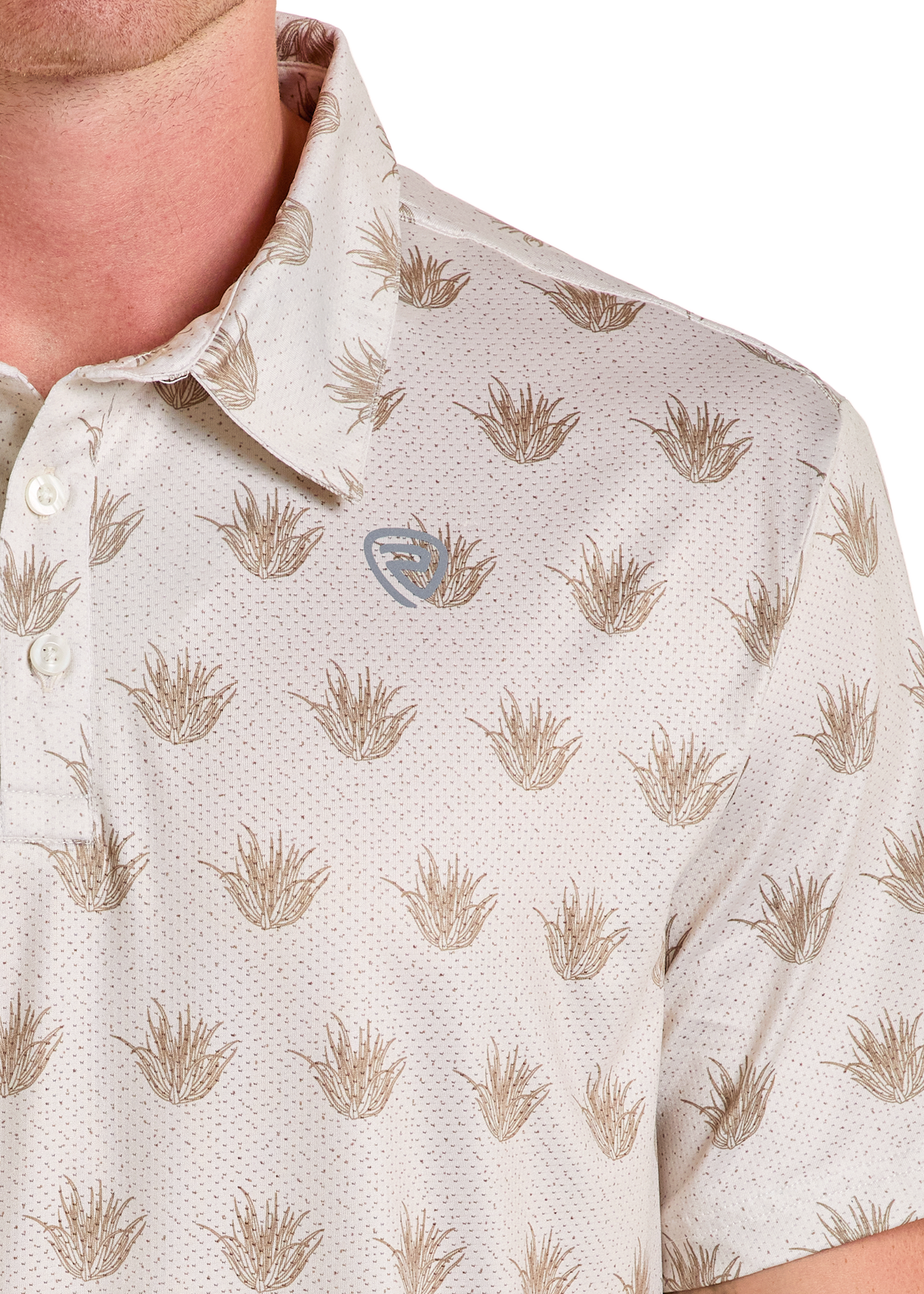 A close-up shows a person in a light-colored Rock & Roll Denim Cactus Print Polo, featuring a brown plant-like pattern and a small chest logo. Only the lower face, neck, and upper torso are visible in this casual style.