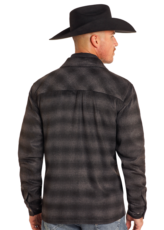 A man stands facing away, wearing the Rock & Roll Denim Brushed Ombre Plaid Zip Up Jacket and a black cowboy hat, paired with light blue jeans.