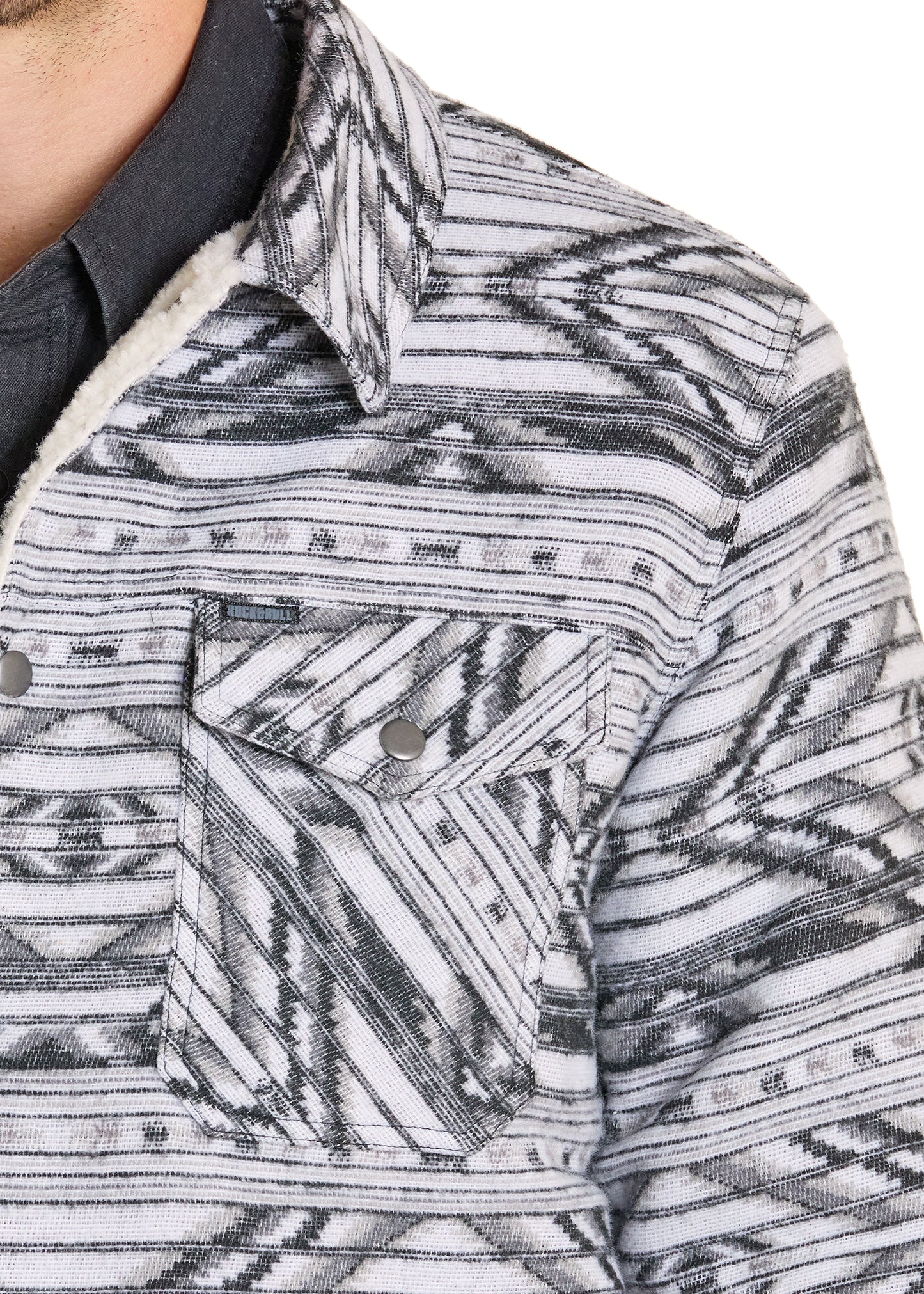 Close-up of a patterned shirt with geometric design