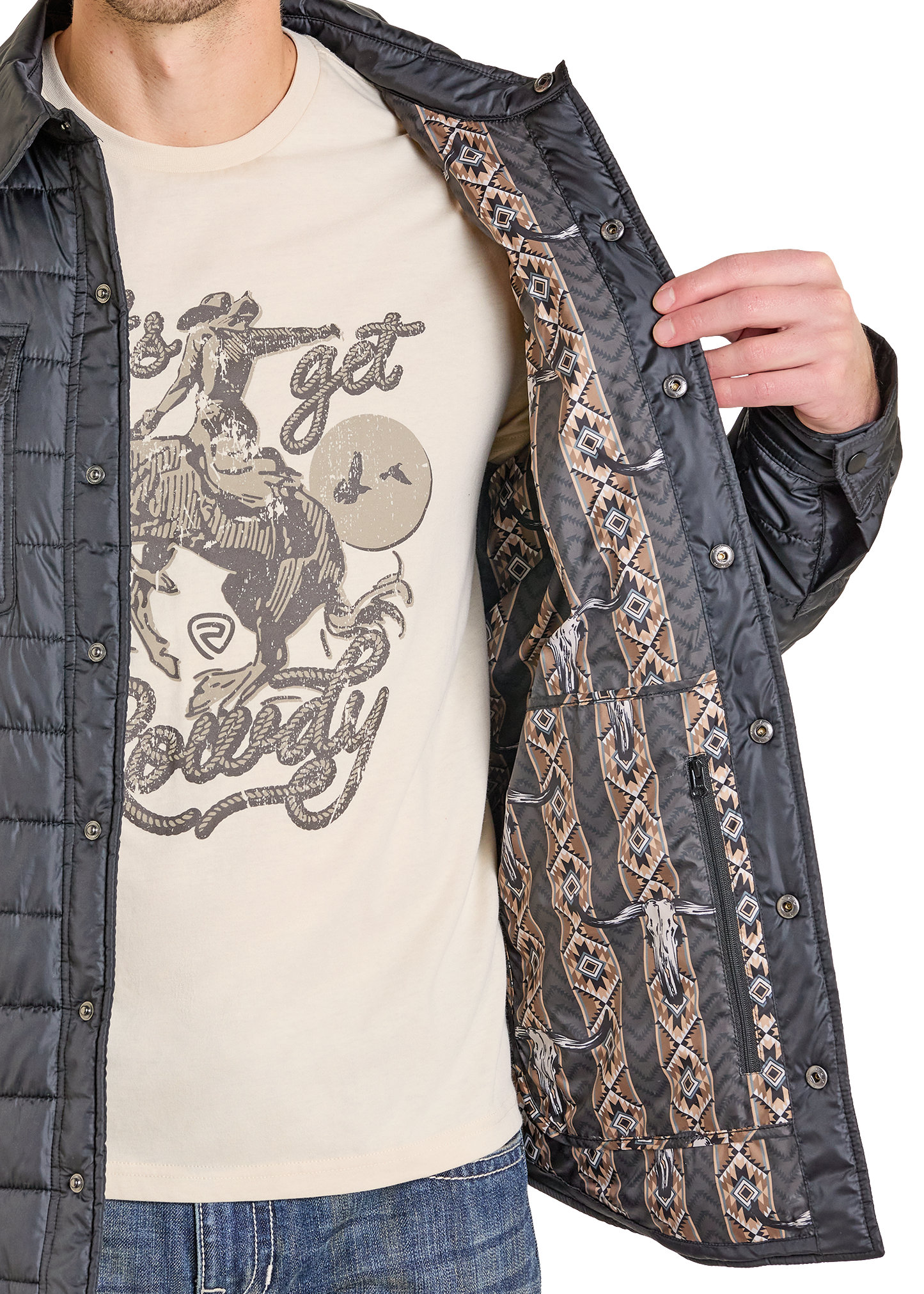 A man in jeans and a graphic tee opens a black Rock & Roll Denim Puffer Print Lined Shirt Jacket, revealing its brown and tan geometric lining. Only the lower part of his face is visible, showcasing the jacket's stylish versatility.