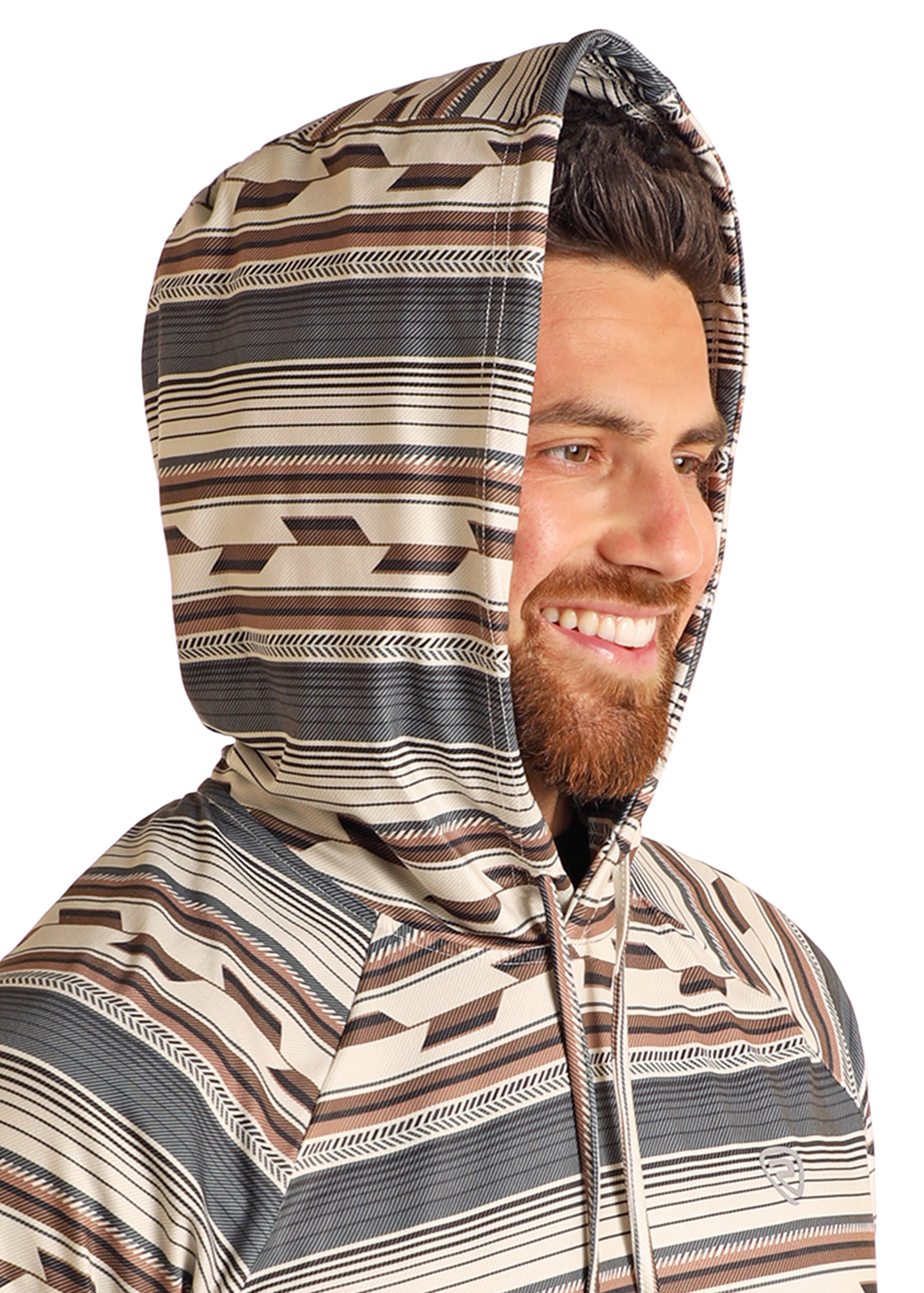 A bearded man smiles while wearing the Rock & Roll Denim Multi Stripe Performance Hoodie, designed with a brown, beige, and gray geometric pattern and comfortable stretch for everyday wear.