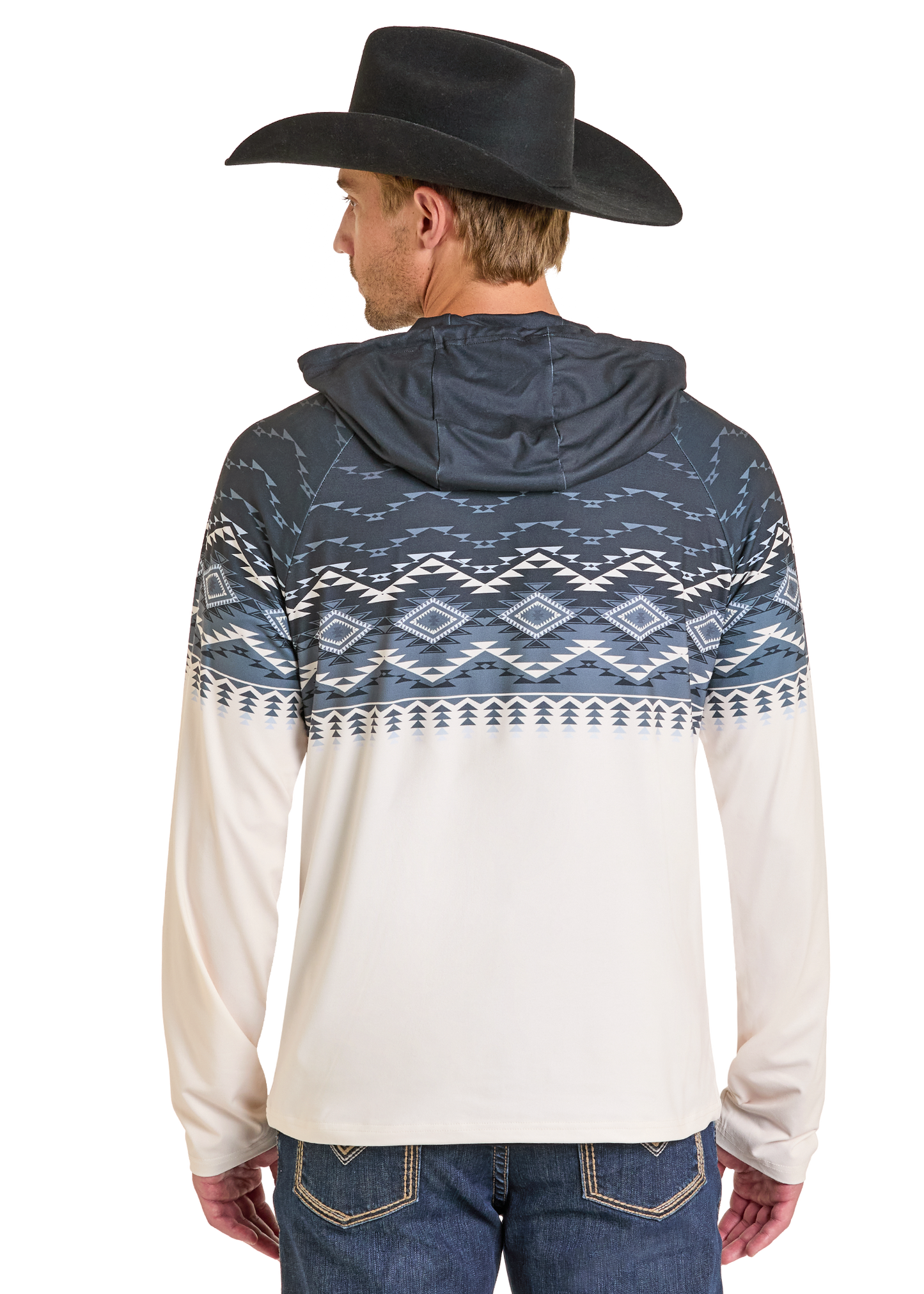 A man in a black cowboy hat and blue jeans stands with his back to the camera, wearing a Rock & Roll Denim Aztec Top Performance Hoodie featuring a blue and white Aztec design on the upper half.