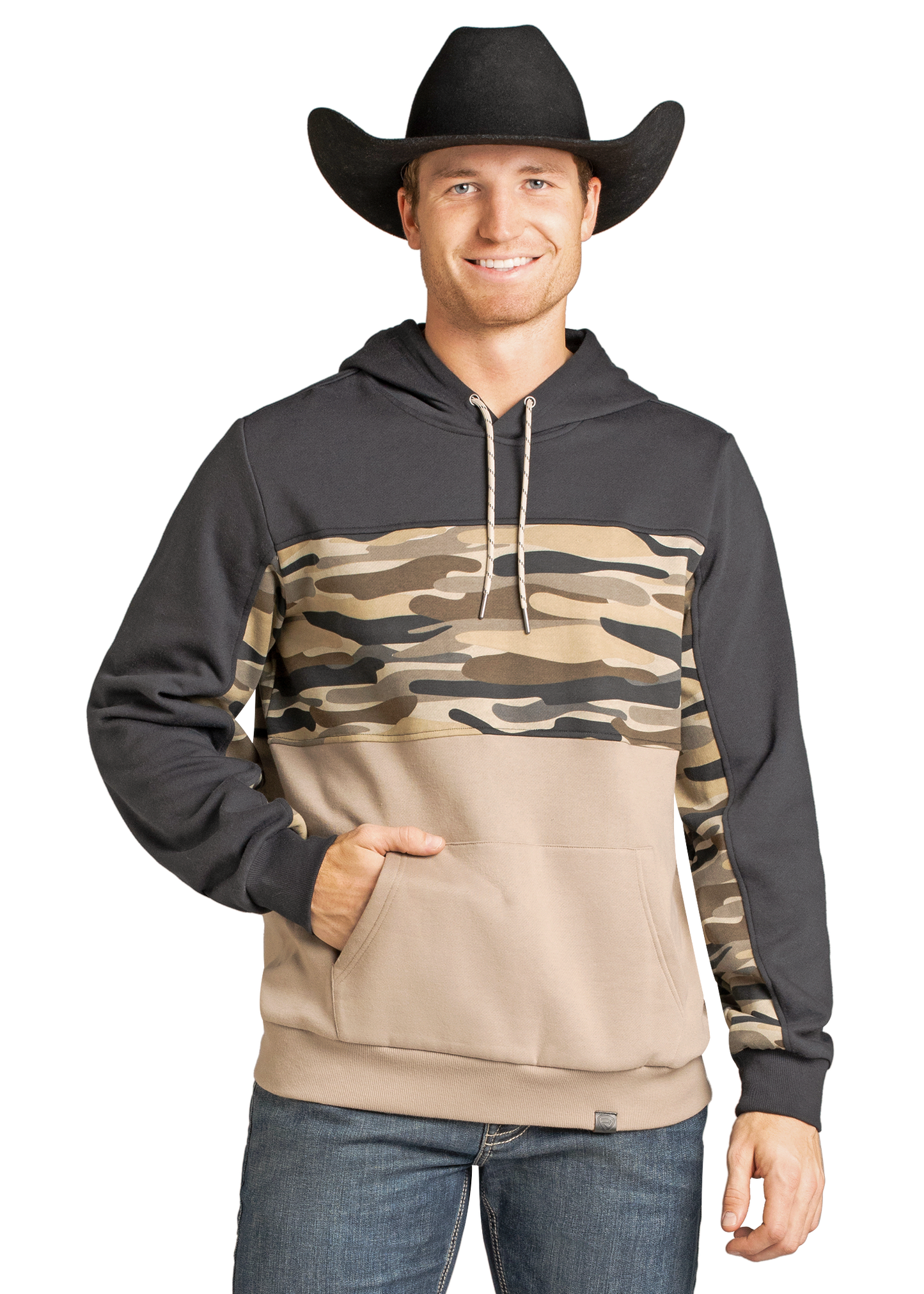 A smiling man in a black cowboy hat wears the Rock & Roll Denim Camo Block Hoodie, featuring dark sleeves, camo pattern on the chest and arms, a tan lower half, and a kangaroo pocket. He pairs it with blue jeans for a casual look.