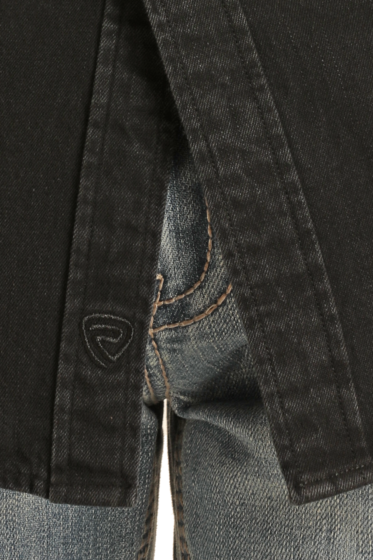 Close-up of a person in blue jeans and a black jacket, highlighting the hem and stitching details, with part of the Rock & Roll Denim Slim Fit Black Wash Denim Snap Shirt logo visible at the edge.