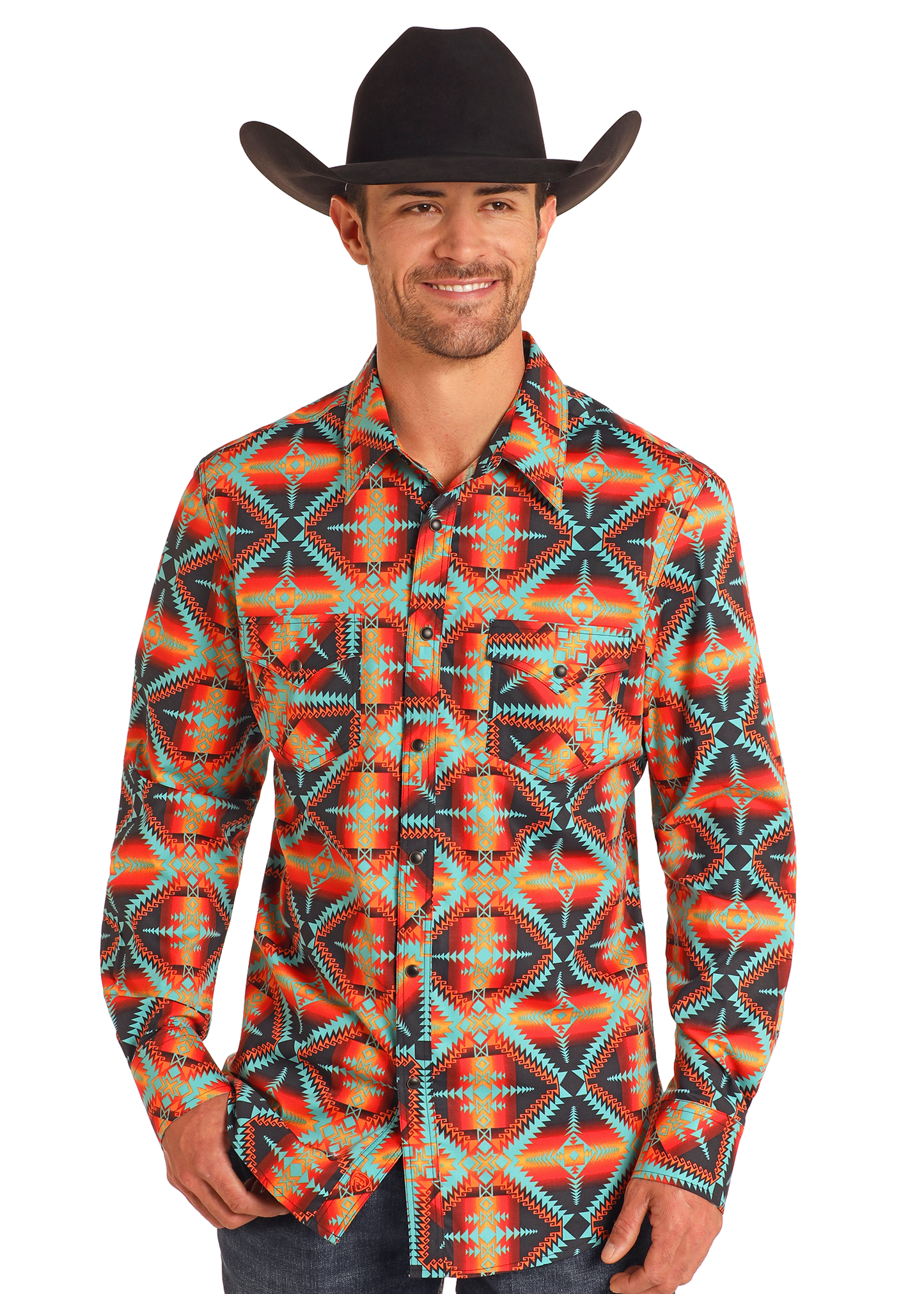 A man in a black cowboy hat and Rock & Roll Denim Slim Fit Red Aztec Long Sleeve Snap Shirt, featuring colorful geometric patterns, stands smiling against a plain white background.