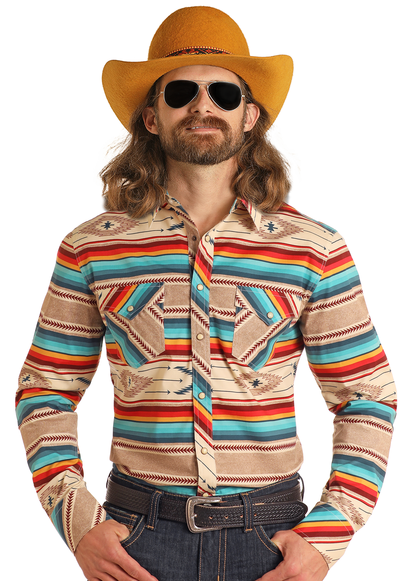 A man with long hair and a beard wears a yellow cowboy hat, aviator sunglasses, and the Rock & Roll Denim Dale Brisby Slim Fit Southwestern Serape Long Sleeve Snap Shirt, plus blue jeans and a brown belt, posing confidently against a white background.