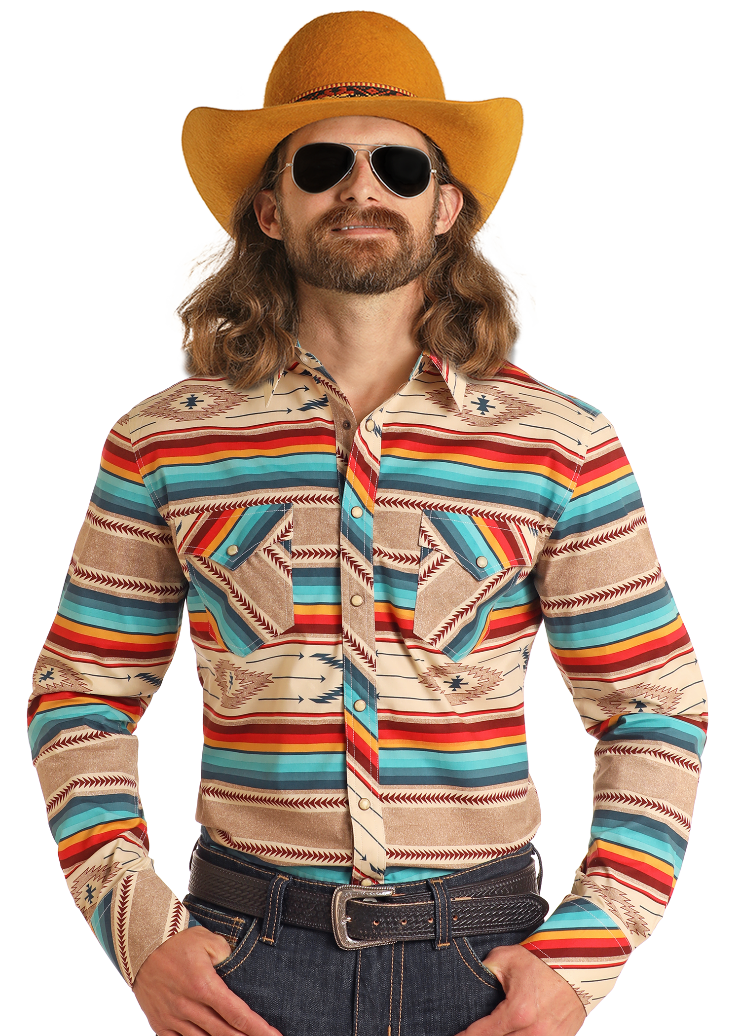 A man with long hair and a beard wears a yellow cowboy hat, aviator sunglasses, and the Rock & Roll Denim Dale Brisby Slim Fit Southwestern Serape Long Sleeve Snap Shirt, plus blue jeans and a brown belt, posing confidently against a white background.