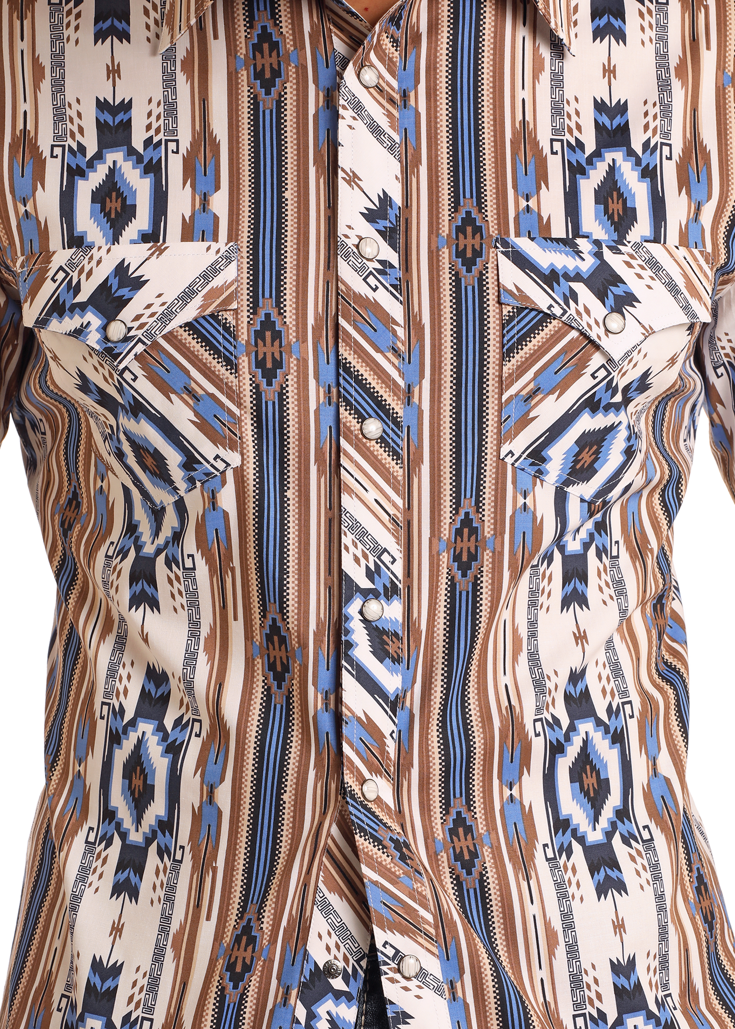 Close-up of the Rock & Roll Denim Slim Fit Tan Southwestern Striped Long Sleeve Snap Shirt, featuring a geometric western print, pointed flap pockets, and pearl snap buttons in brown, blue, black, and white.