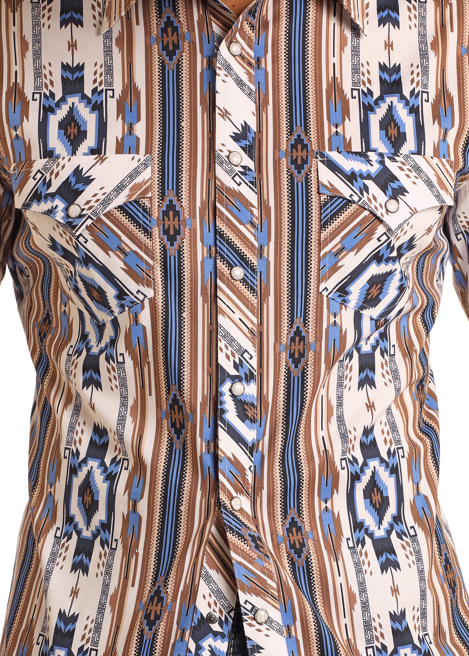 Close-up of the Rock & Roll Denim Slim Fit Tan Southwestern Striped Long Sleeve Snap Shirt, featuring a geometric western print, pointed flap pockets, and pearl snap buttons in brown, blue, black, and white.