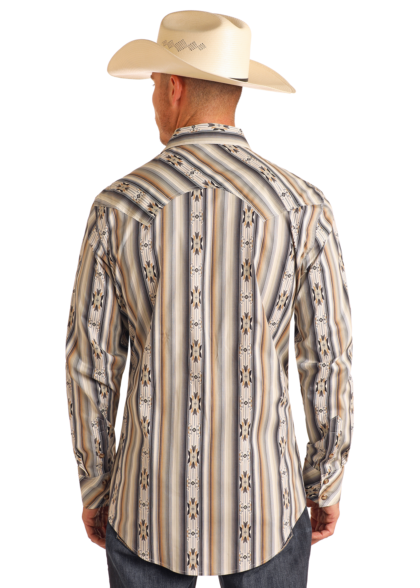 A man in a cream cowboy hat and the Rock & Roll Denim Slim Fit Tan Striped Aztec Long Sleeve Snap Shirt stands facing away, showcasing the shirt’s geometric back design.