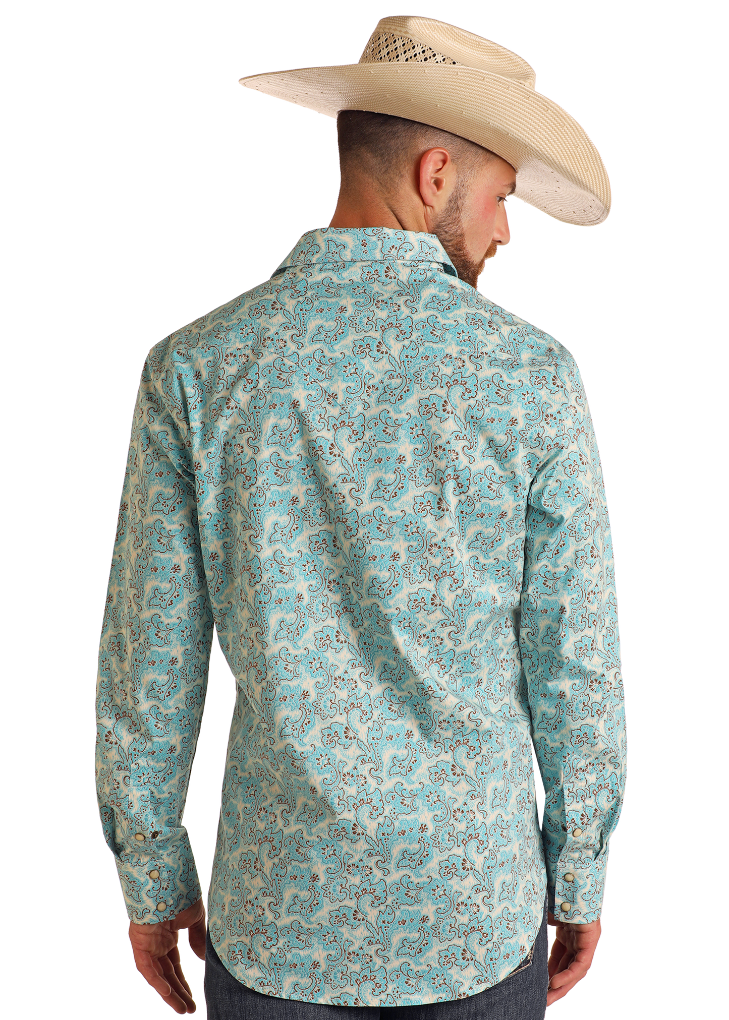 A man faces away, displaying the back of his Rock & Roll Denim Slim Fit Turquoise Paisley Print Long Sleeve Snap Shirt with dark jeans and a light cowboy hat against a plain white background.