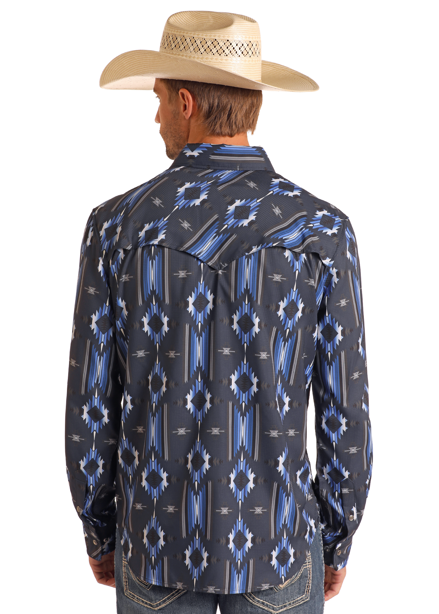 A man shown from the back wears a light-colored cowboy hat, blue jeans, and a Rock & Roll Denim TEK Western Navy Aztec Long Sleeve Shirt featuring blue and white geometric patterns.