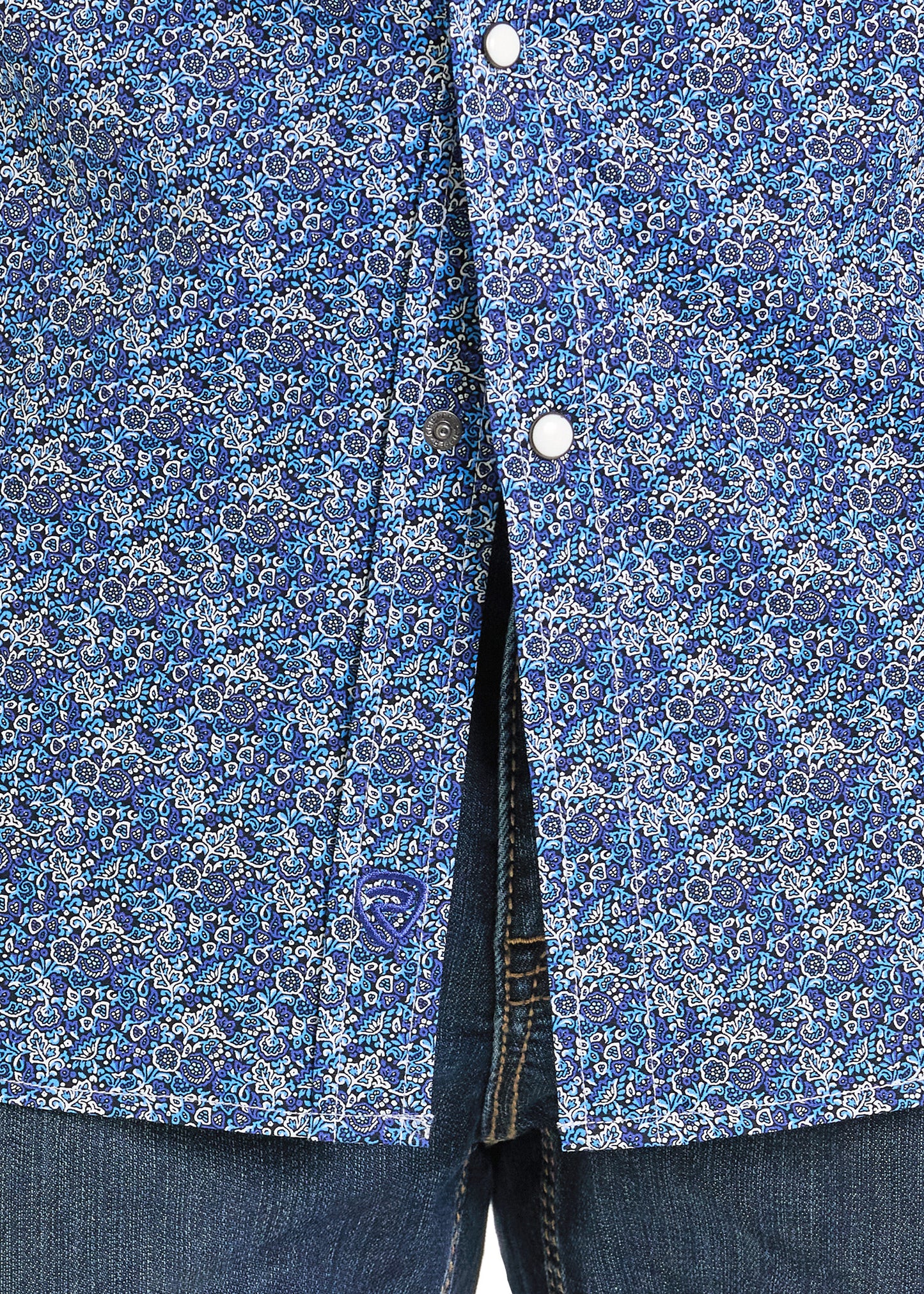 Close-up of a blue floral patterned shirt with buttons.