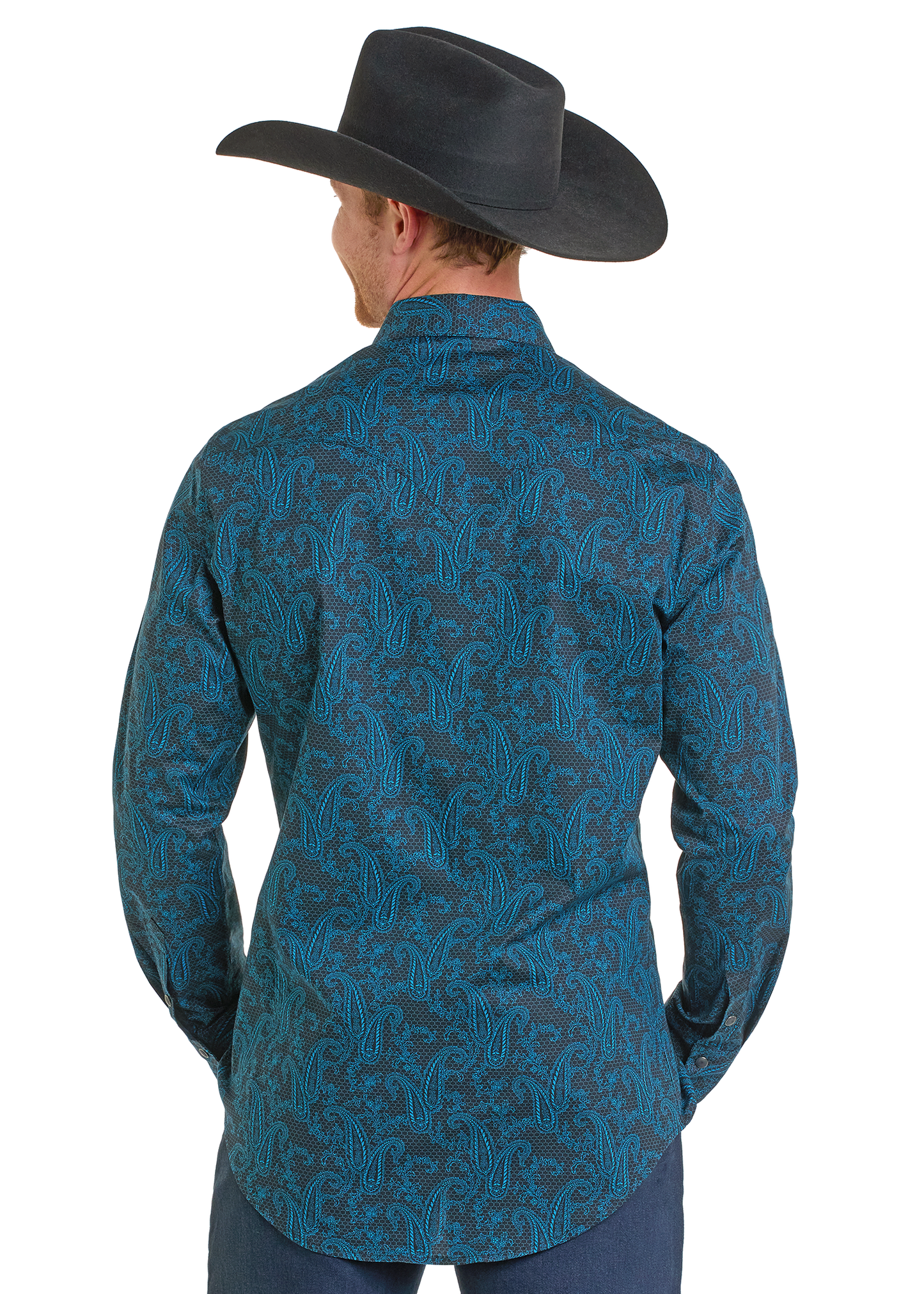 A man in a black cowboy hat and a Rock & Roll Denim Slim Fit Dark Paisley Long Sleeve Snap Shirt stands with his back to the camera, hands on his hips.