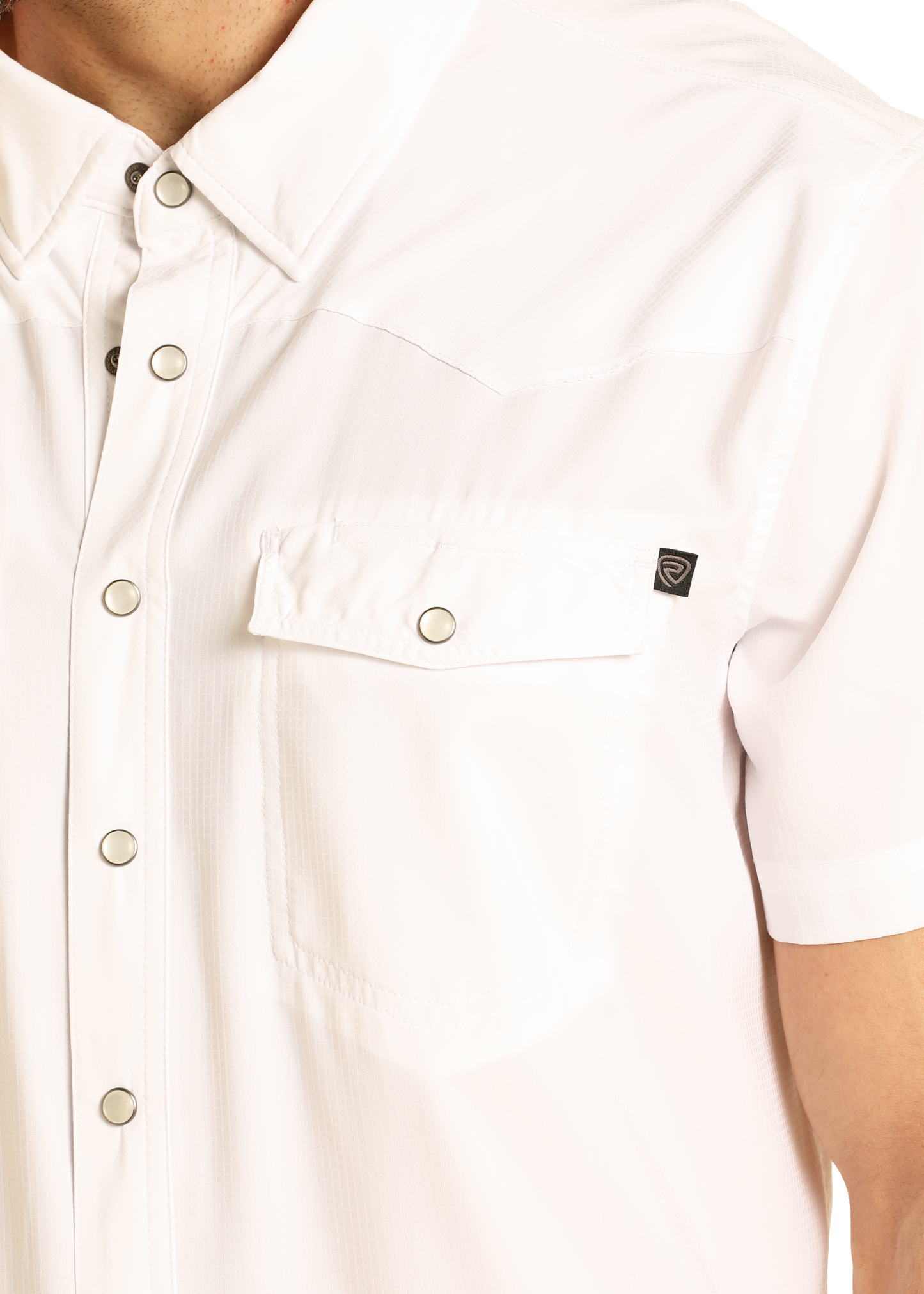 A close-up of the upper torso shows a person wearing the Rock & Roll Denim TEK Western White Short Sleeve Shirt, featuring snaps and a flap chest pocket.