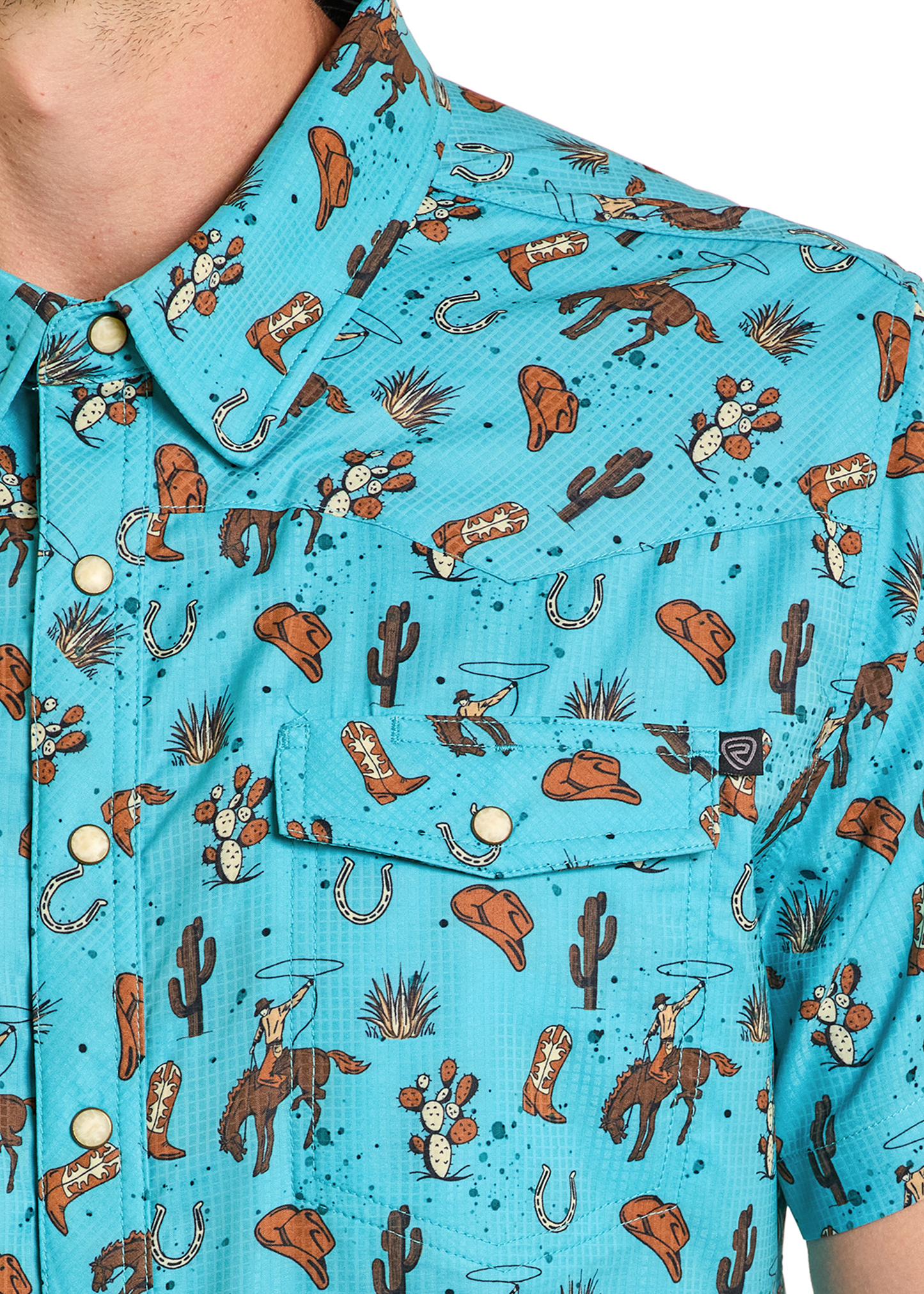 Close-up of a blue shirt with cowboy-themed pattern
