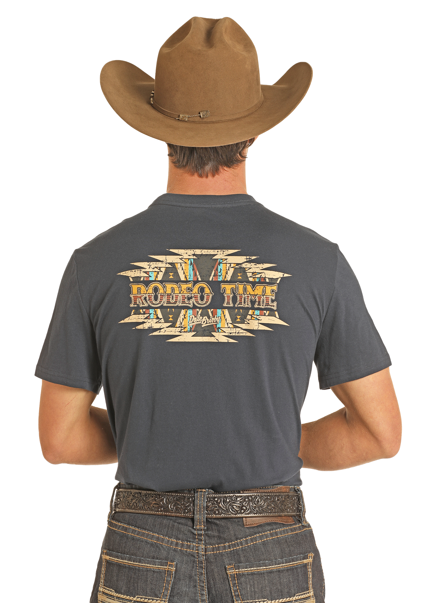 A man in a brown cowboy hat and Western jeans faces away, showing off his Rock & Roll Denim Dale Brisby Rodeo Time Tee with bold "RODEO TIME" lettering on the back.