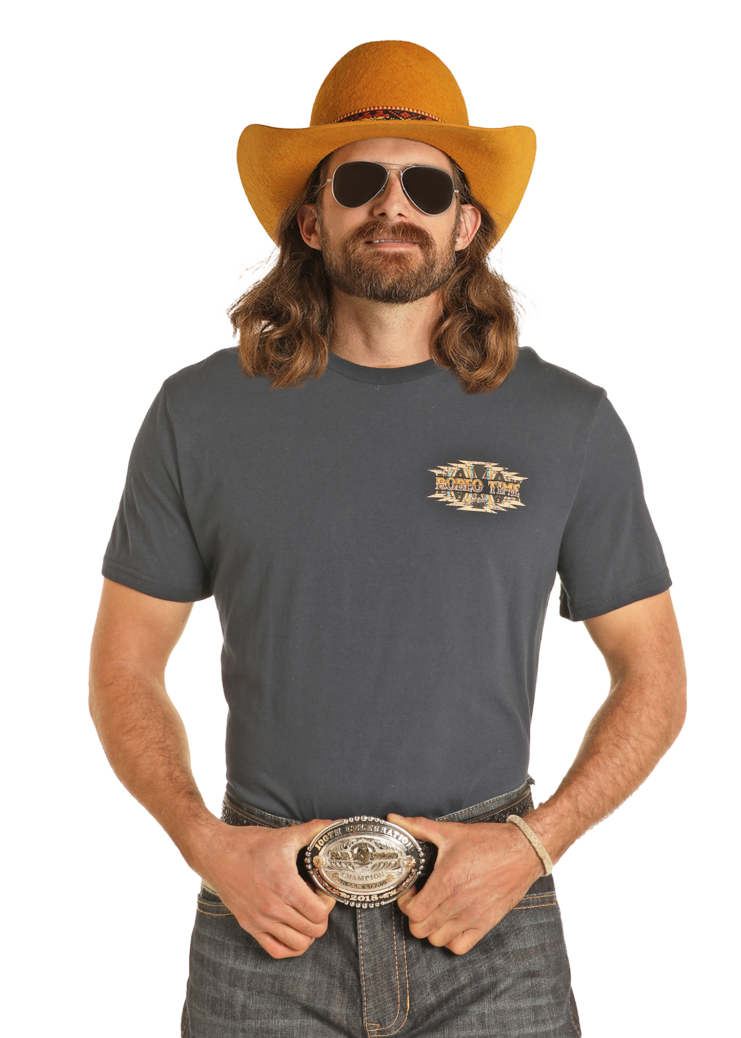 A man with long hair and a beard wears a yellow cowboy hat, sunglasses, jeans, and the Dale Brisby Rodeo Time Tee by Rock & Roll Denim with a decorative belt buckle—showing off that Rodeo Time spirit against a white background.