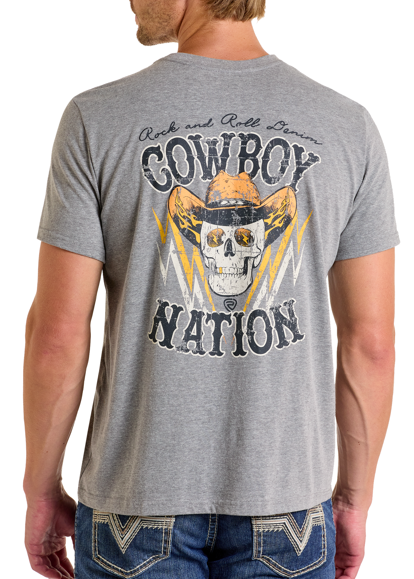 A man wears the comfortable Cowboy Nation Graphic Tee by Rock & Roll Denim—a gray tee featuring a skull in a cowboy hat, yellow lightning bolts, and “Cowboy Nation” on the back—ideal for everyday wear.