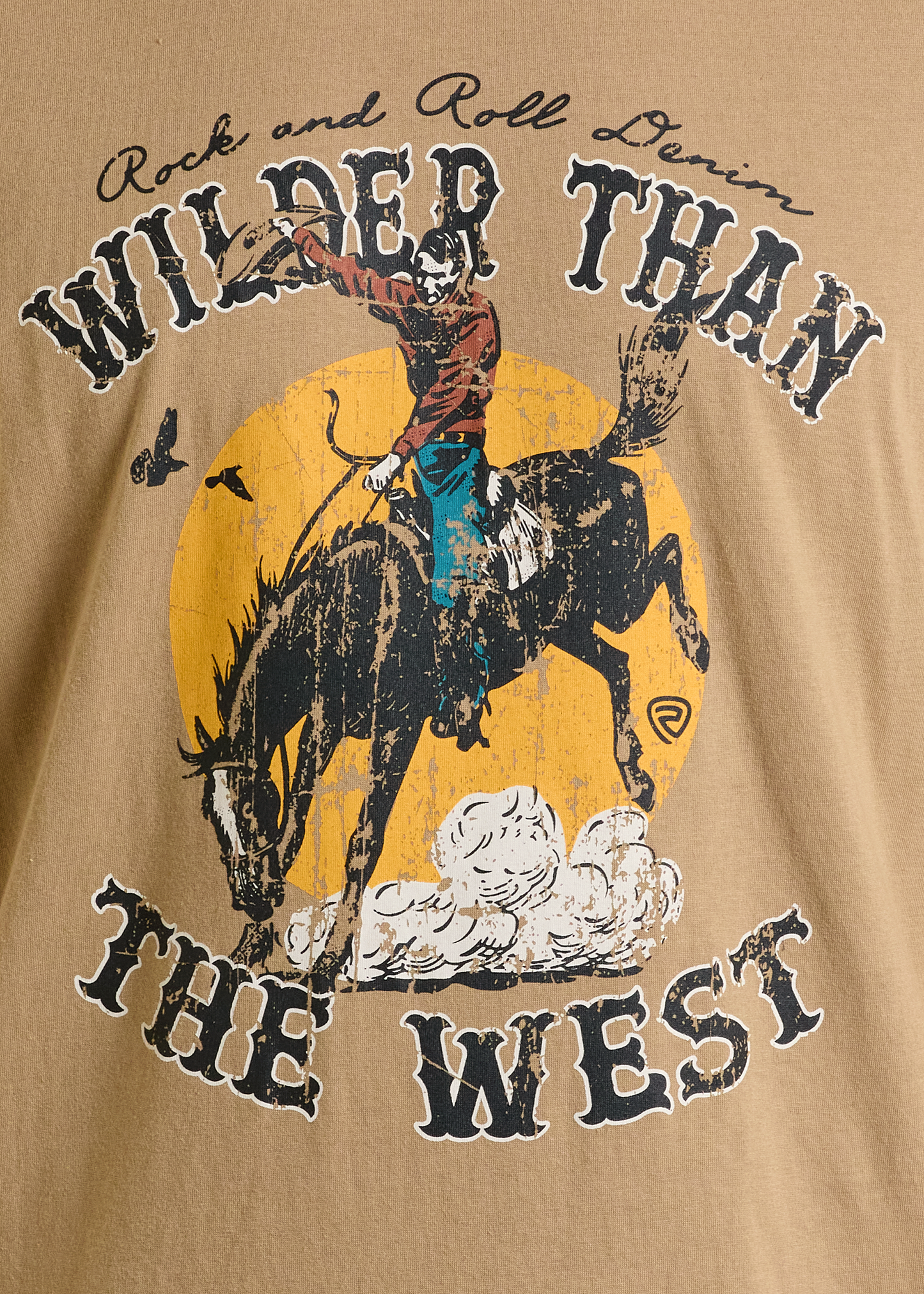 The Wilder Than The West Unisex Graphic Tee by Rock & Roll Denim features a cowboy on a bucking horse before a yellow sun, "Wilder Than The West" text, and a flying bird—offering comfort and style for all.