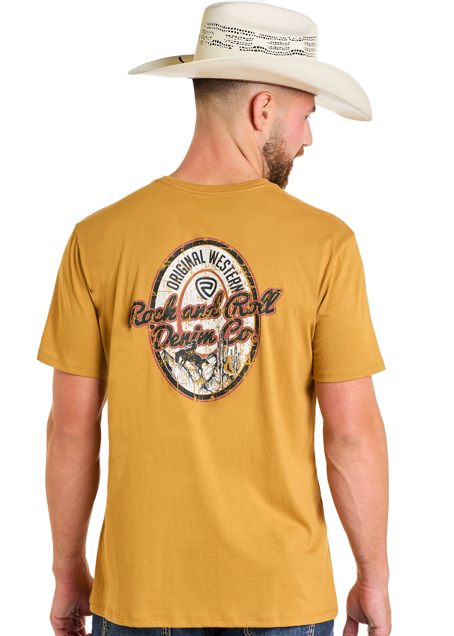 A man in a tan cowboy hat and a mustard yellow Rock & Roll Denim Original Western Denim Co Unisex Graphic Tee, featuring a vintage-style back graphic, stands with his back to the camera.
