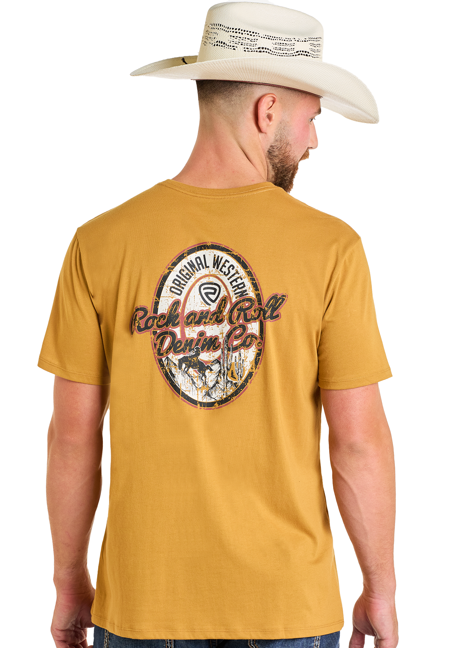 A man in a tan cowboy hat and a mustard yellow Rock & Roll Denim Original Western Denim Co Unisex Graphic Tee, featuring a vintage-style back graphic, stands with his back to the camera.