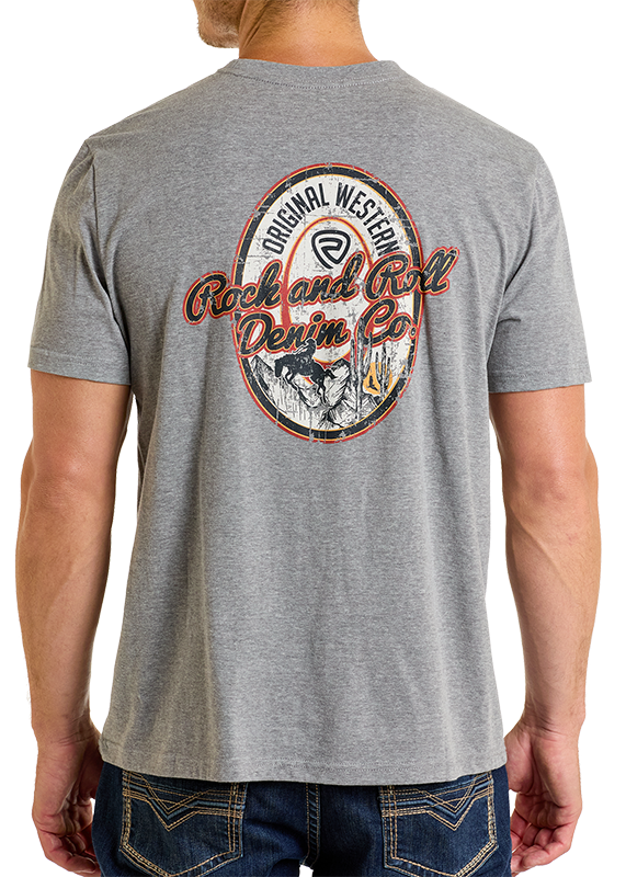 Someone wears the Denim Co Unisex Graphic Tee by Rock & Roll Denim, featuring a large circular rodeo graphic on the back with “Original Western Rock and Roll Denim Co” in red and blue text for a comfortable fit.