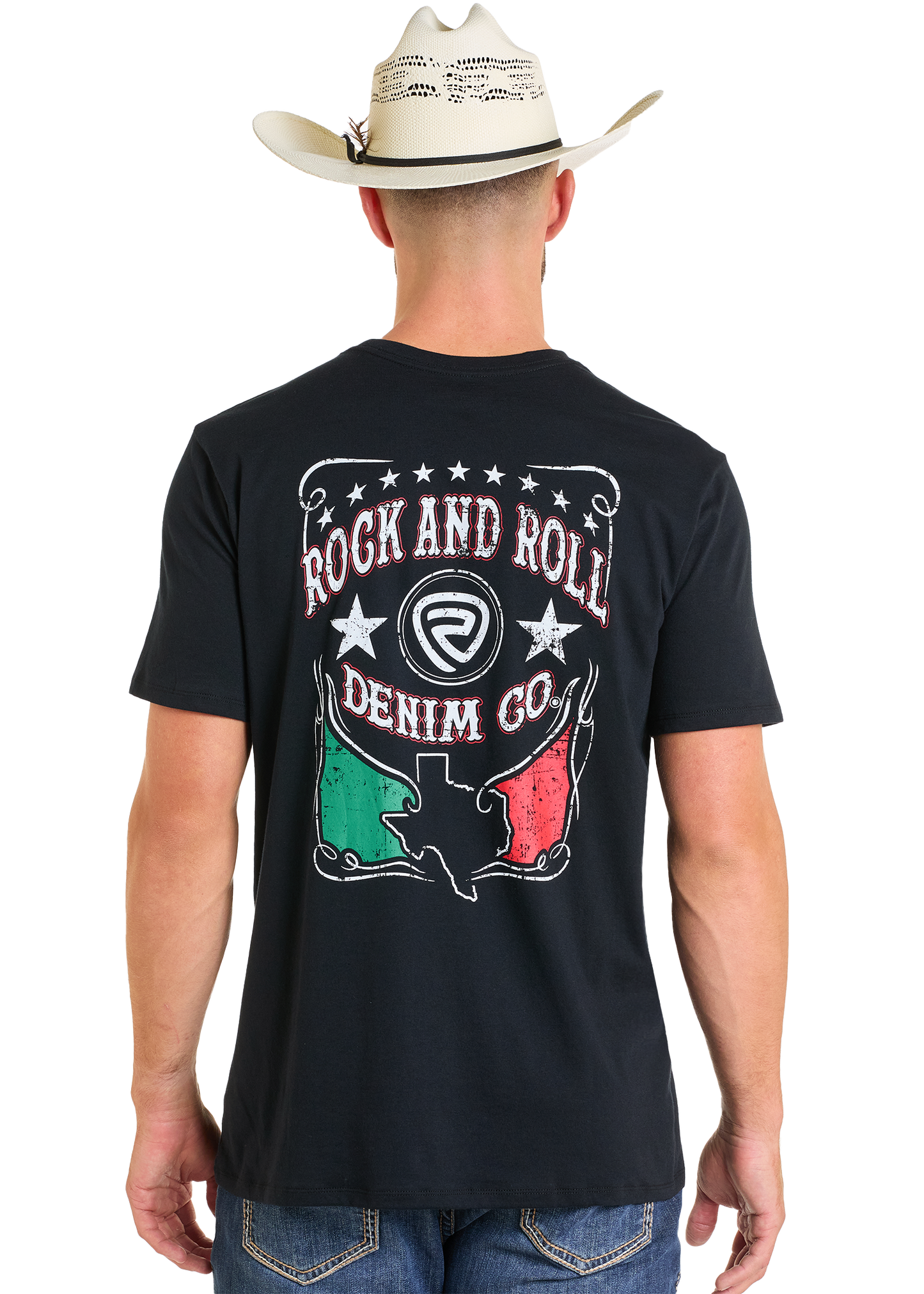 A man in a cowboy hat and black tee stands facing away. The Rock & Roll Denim Mexicano Unisex Graphic Tee features “Rock and Roll Denim Co” with a Texas graphic, stars, and red, white, and green colors on the back.