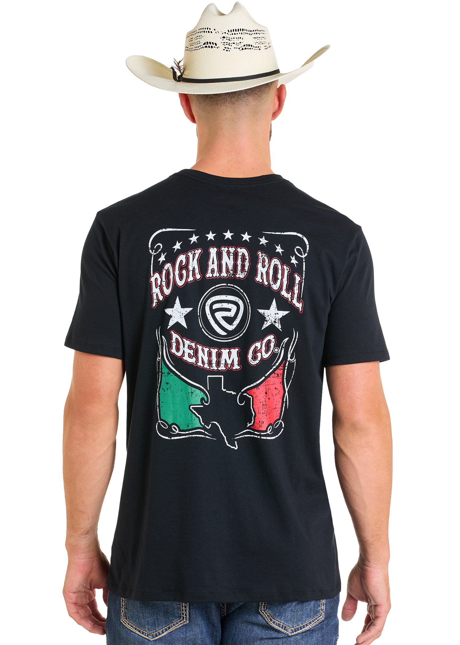 A man in a cowboy hat and black tee stands facing away. The Rock & Roll Denim Mexicano Unisex Graphic Tee features “Rock and Roll Denim Co” with a Texas graphic, stars, and red, white, and green colors on the back.
